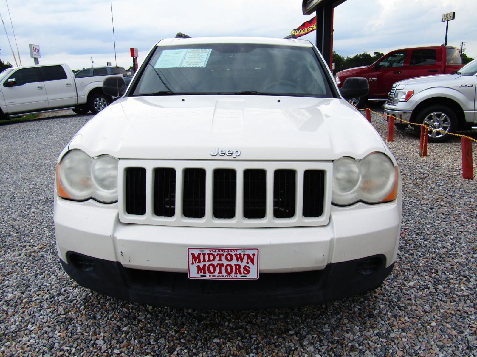 2010 WHITE /Black Jeep Grand Cherokee Laredo 2WD (1J4PS4GK9AC) with an 3.7L V6 SOHC 12V engine, Automatic transmission, located at 15016 S Hwy 231, Midland City, AL, 36350, (334) 983-3001, 31.306210, -85.495277 - Photo #1