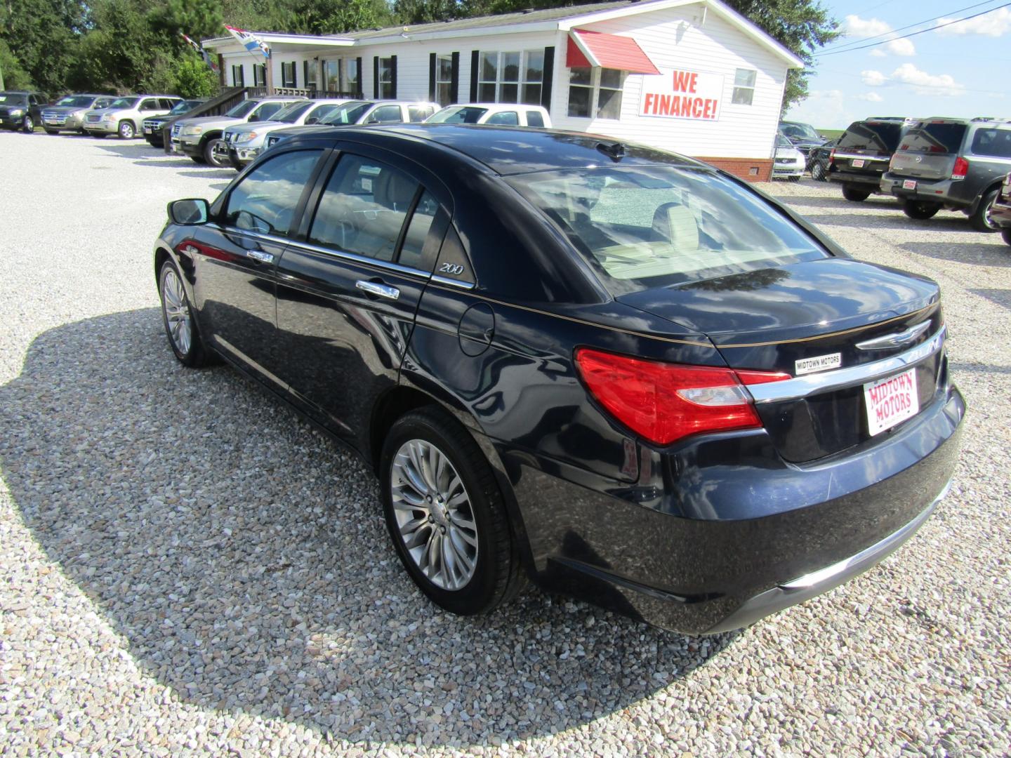 2012 DK Blue /Tan Chrysler 200 Limited (1C3CCBCG6CN) with an 3.6L V6 DOHC 24V FFV engine, Automatic transmission, located at 15016 S Hwy 231, Midland City, AL, 36350, (334) 983-3001, 31.306210, -85.495277- Photo#4