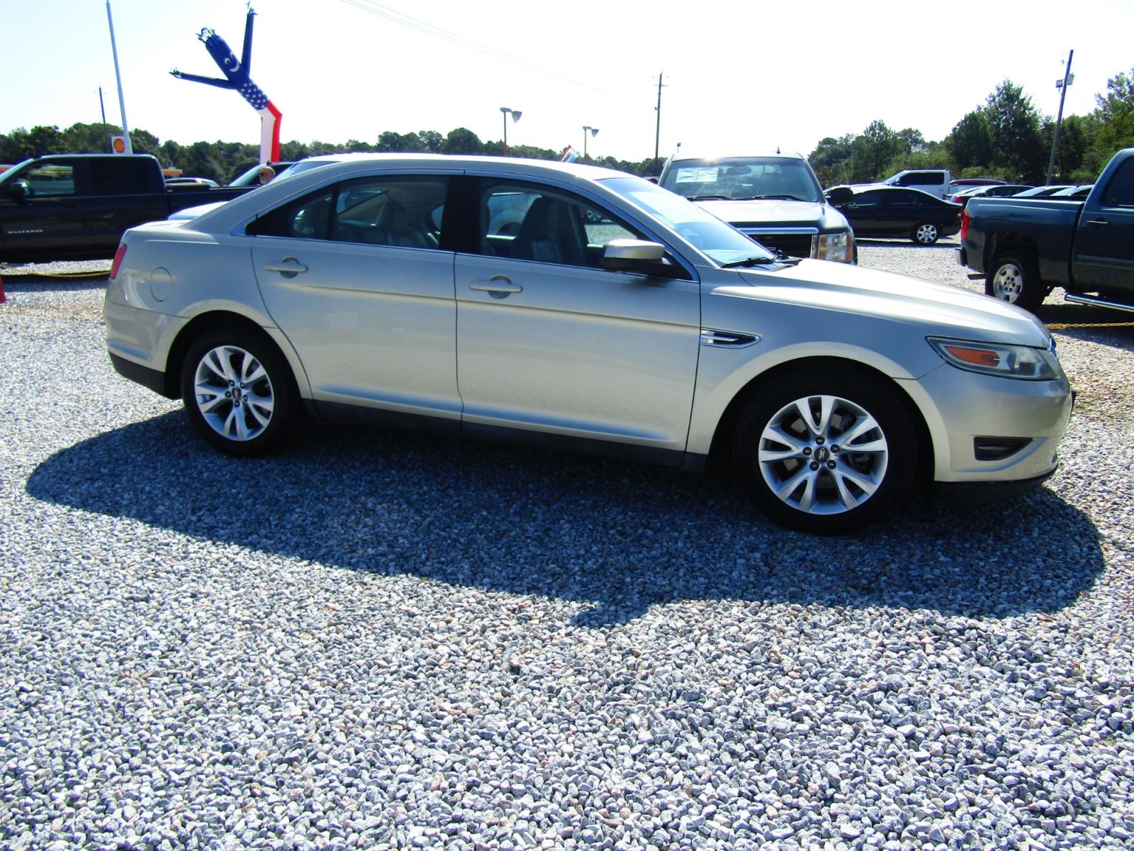 2011 Gold /Tan Ford Taurus SEL FWD (1FAHP2EW4BG) with an 3.5L V6 DOHC 24V engine, Automatic transmission, located at 15016 S Hwy 231, Midland City, AL, 36350, (334) 983-3001, 31.306210, -85.495277 - Photo #0