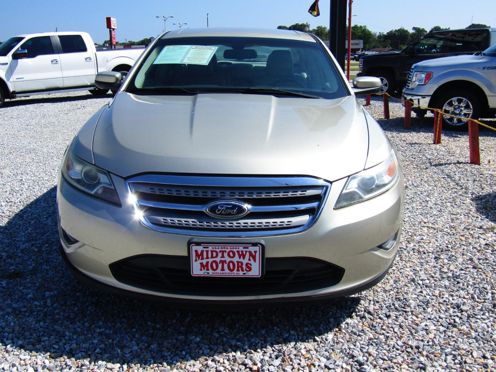 2011 Gold /Tan Ford Taurus SEL FWD (1FAHP2EW4BG) with an 3.5L V6 DOHC 24V engine, Automatic transmission, located at 15016 S Hwy 231, Midland City, AL, 36350, (334) 983-3001, 31.306210, -85.495277 - Photo #1