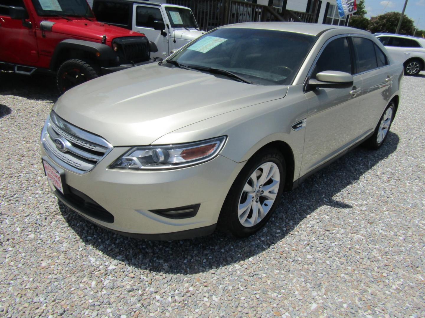2011 Gold /Tan Ford Taurus SEL FWD (1FAHP2EW4BG) with an 3.5L V6 DOHC 24V engine, Automatic transmission, located at 15016 S Hwy 231, Midland City, AL, 36350, (334) 983-3001, 31.306210, -85.495277 - Photo#1