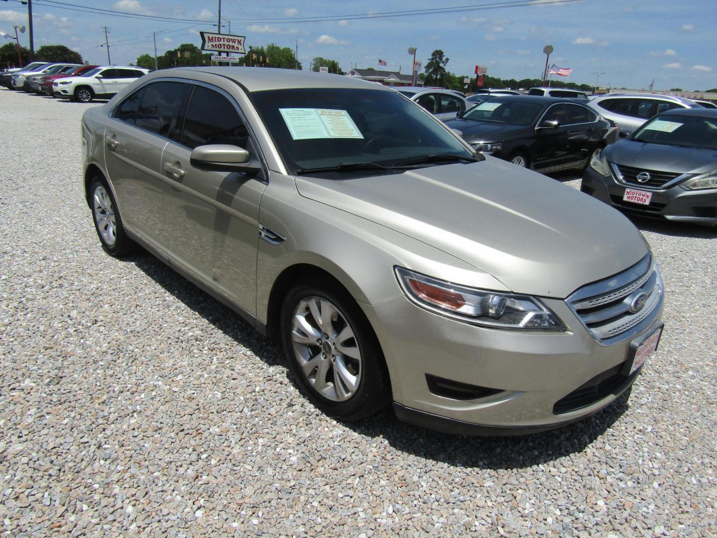 2011 Gold /Tan Ford Taurus SEL FWD (1FAHP2EW4BG) with an 3.5L V6 DOHC 24V engine, Automatic transmission, located at 15016 S Hwy 231, Midland City, AL, 36350, (334) 983-3001, 31.306210, -85.495277 - Photo#0