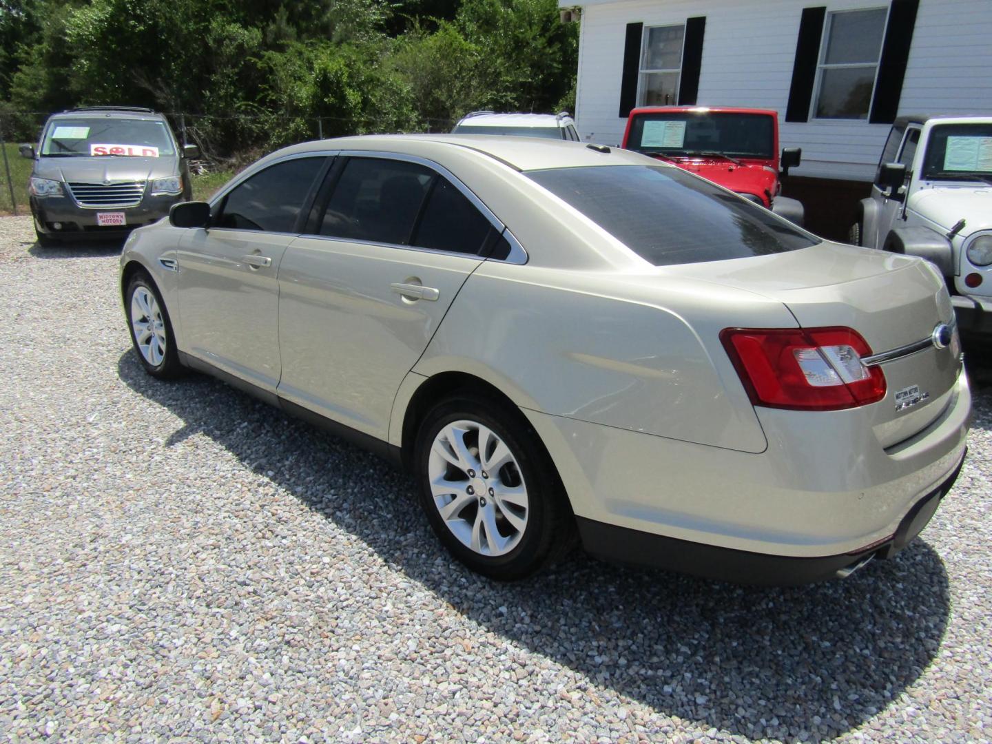 2011 Gold /Tan Ford Taurus SEL FWD (1FAHP2EW4BG) with an 3.5L V6 DOHC 24V engine, Automatic transmission, located at 15016 S Hwy 231, Midland City, AL, 36350, (334) 983-3001, 31.306210, -85.495277 - Photo#4