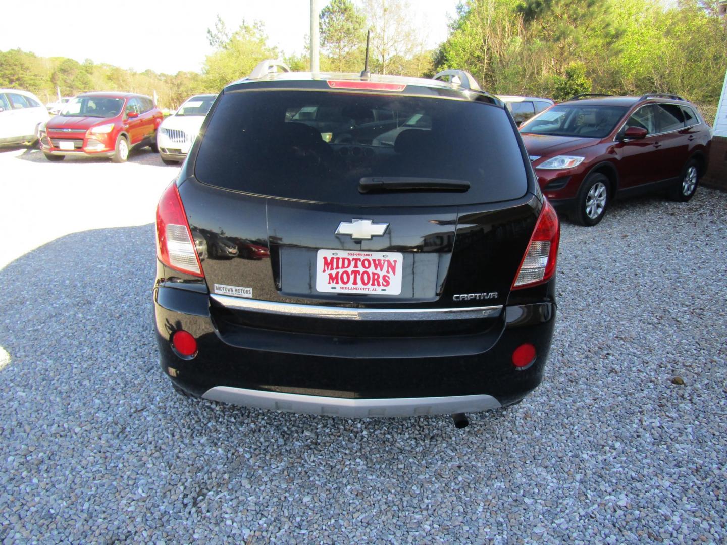 2015 Black Chevrolet Captiva Sport 1LT FWD (3GNAL3EK8FS) with an 2.4L L4 DOHC 16V FFV engine, Automatic transmission, located at 15016 S Hwy 231, Midland City, AL, 36350, (334) 983-3001, 31.306210, -85.495277 - Photo#4