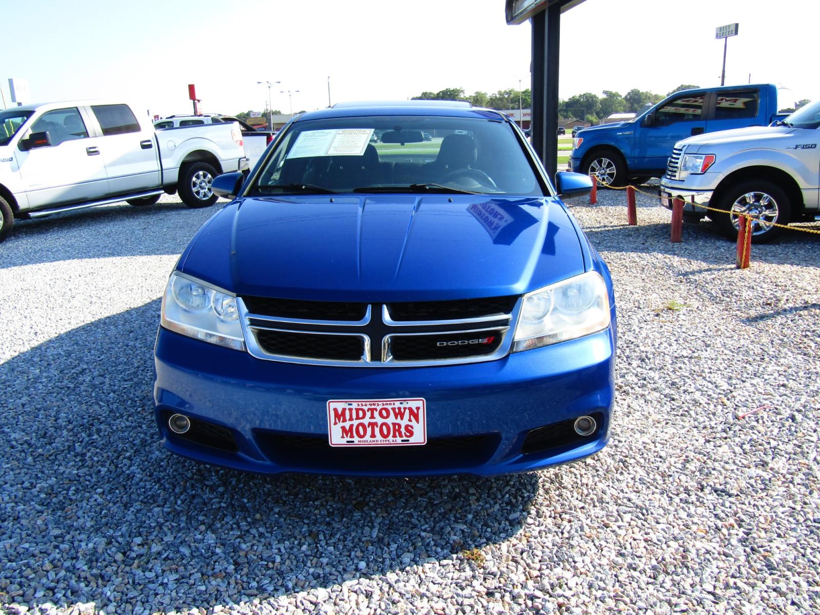 2013 Blue Dodge Avenger SXT (1C3CDZCG6DN) with an 3.6L V6 DOHC 24V FFV engine, Automatic transmission, located at 15016 S Hwy 231, Midland City, AL, 36350, (334) 983-3001, 31.306210, -85.495277 - Photo #1