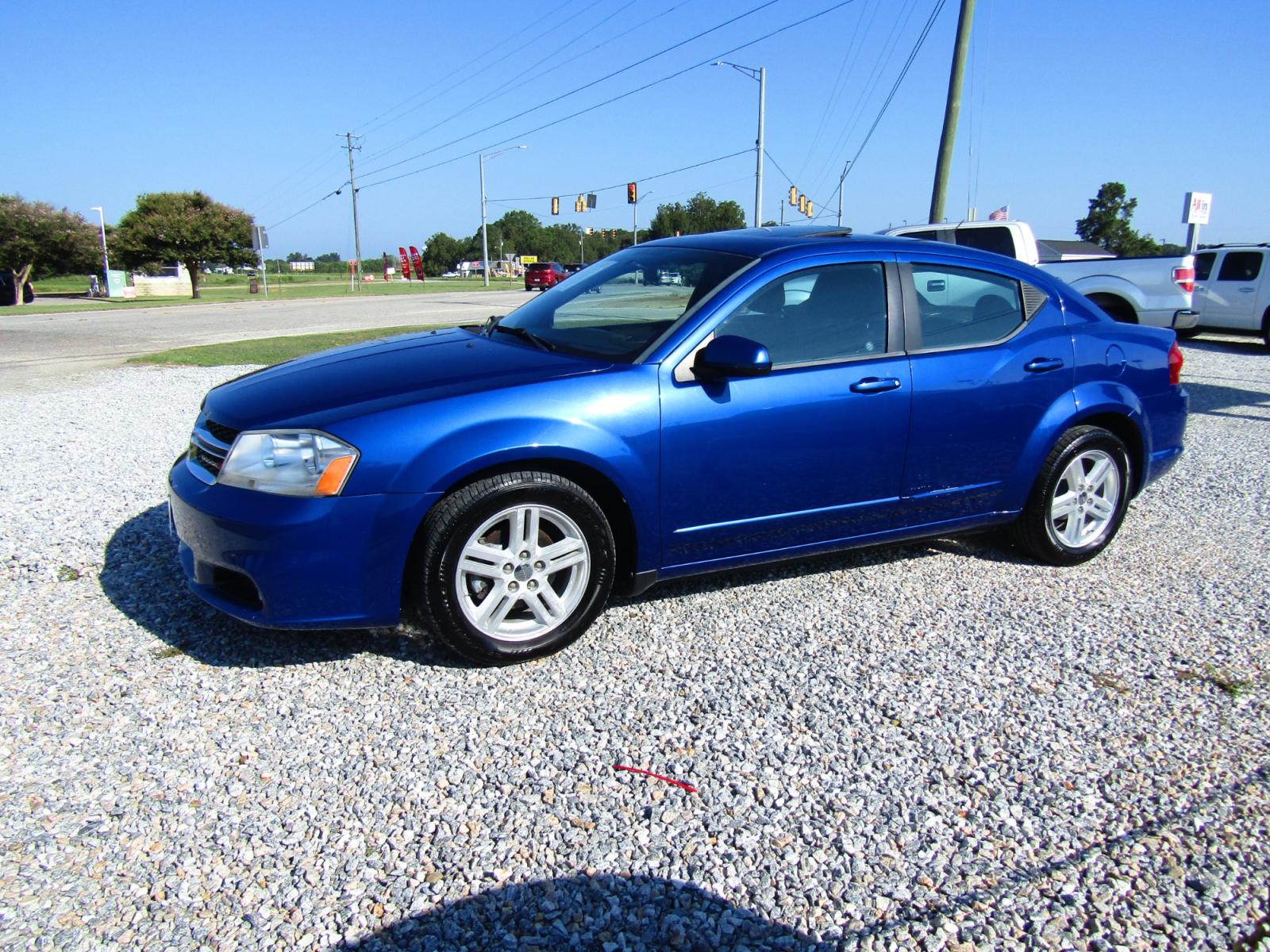 2013 Blue Dodge Avenger SXT (1C3CDZCG6DN) with an 3.6L V6 DOHC 24V FFV engine, Automatic transmission, located at 15016 S Hwy 231, Midland City, AL, 36350, (334) 983-3001, 31.306210, -85.495277 - Photo #2
