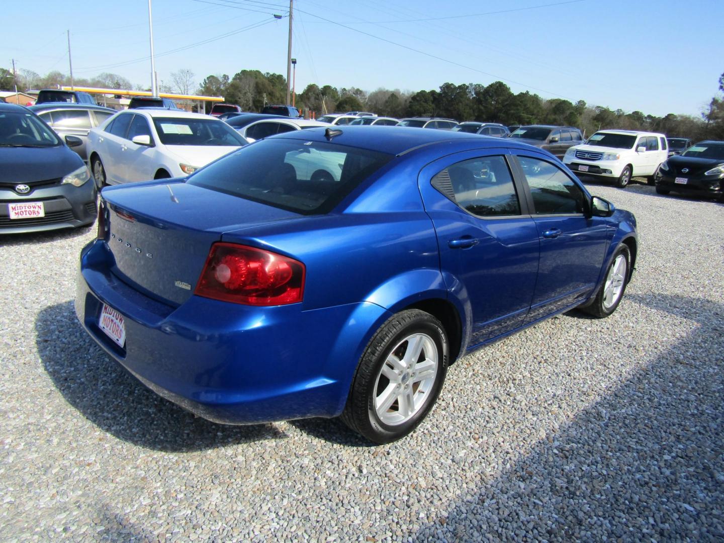 2013 Blue Dodge Avenger SXT (1C3CDZCG6DN) with an 3.6L V6 DOHC 24V FFV engine, Automatic transmission, located at 15016 S Hwy 231, Midland City, AL, 36350, (334) 983-3001, 31.306210, -85.495277 - Photo#7