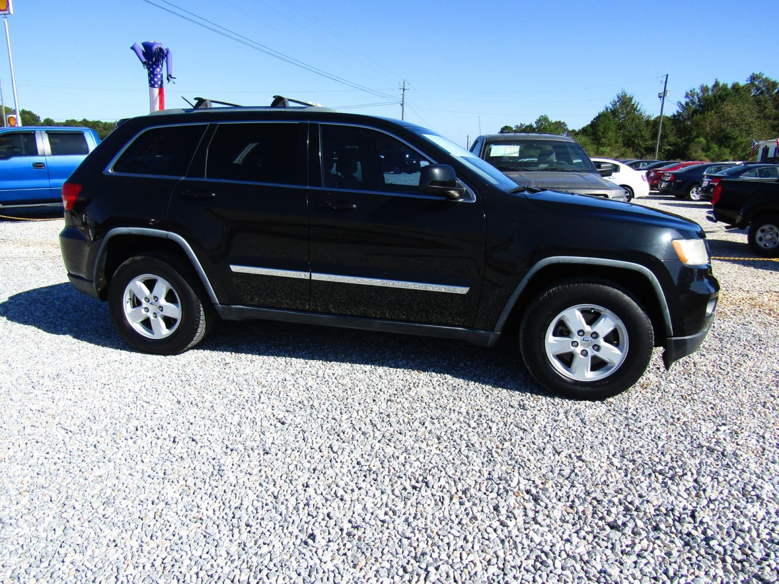 2012 Black /Tan Jeep Grand Cherokee Laredo 2WD (1C4RJEAG2CC) with an 3.6L V6 DOHC 24V engine, Automatic transmission, located at 15016 S Hwy 231, Midland City, AL, 36350, (334) 983-3001, 31.306210, -85.495277 - Photo #0