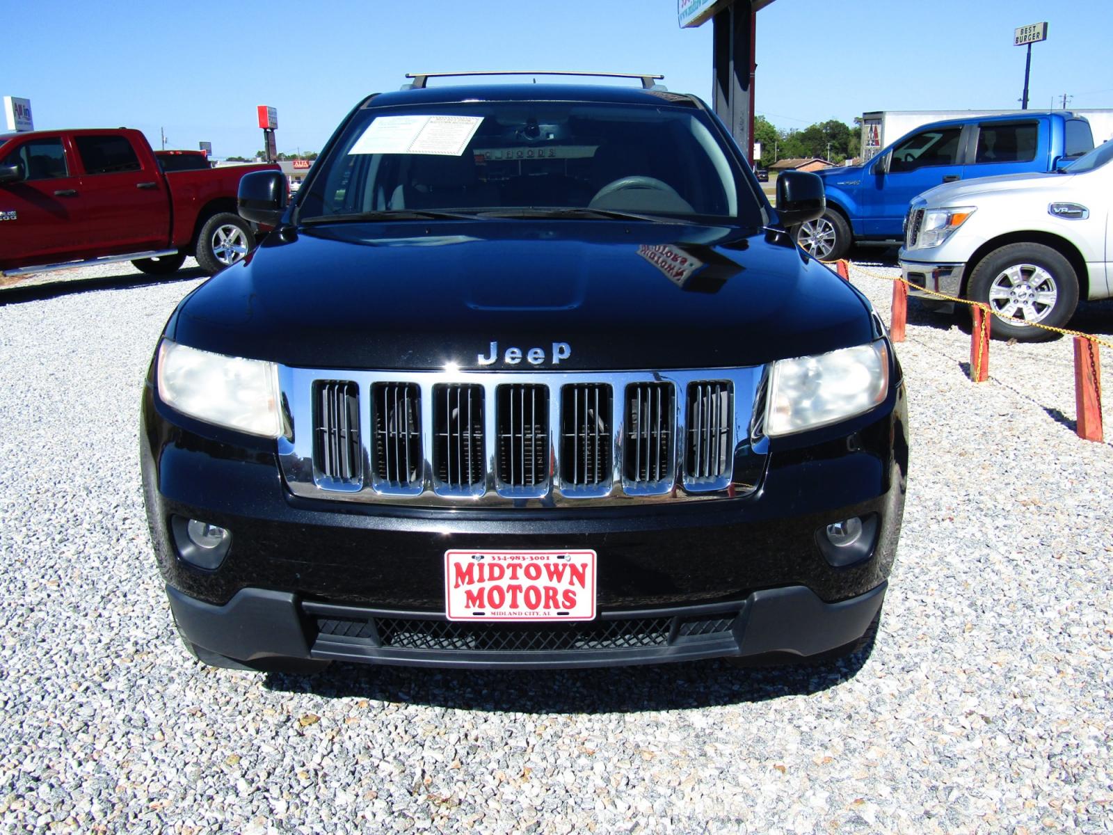 2012 Black /Tan Jeep Grand Cherokee Laredo 2WD (1C4RJEAG2CC) with an 3.6L V6 DOHC 24V engine, Automatic transmission, located at 15016 S Hwy 231, Midland City, AL, 36350, (334) 983-3001, 31.306210, -85.495277 - Photo #1