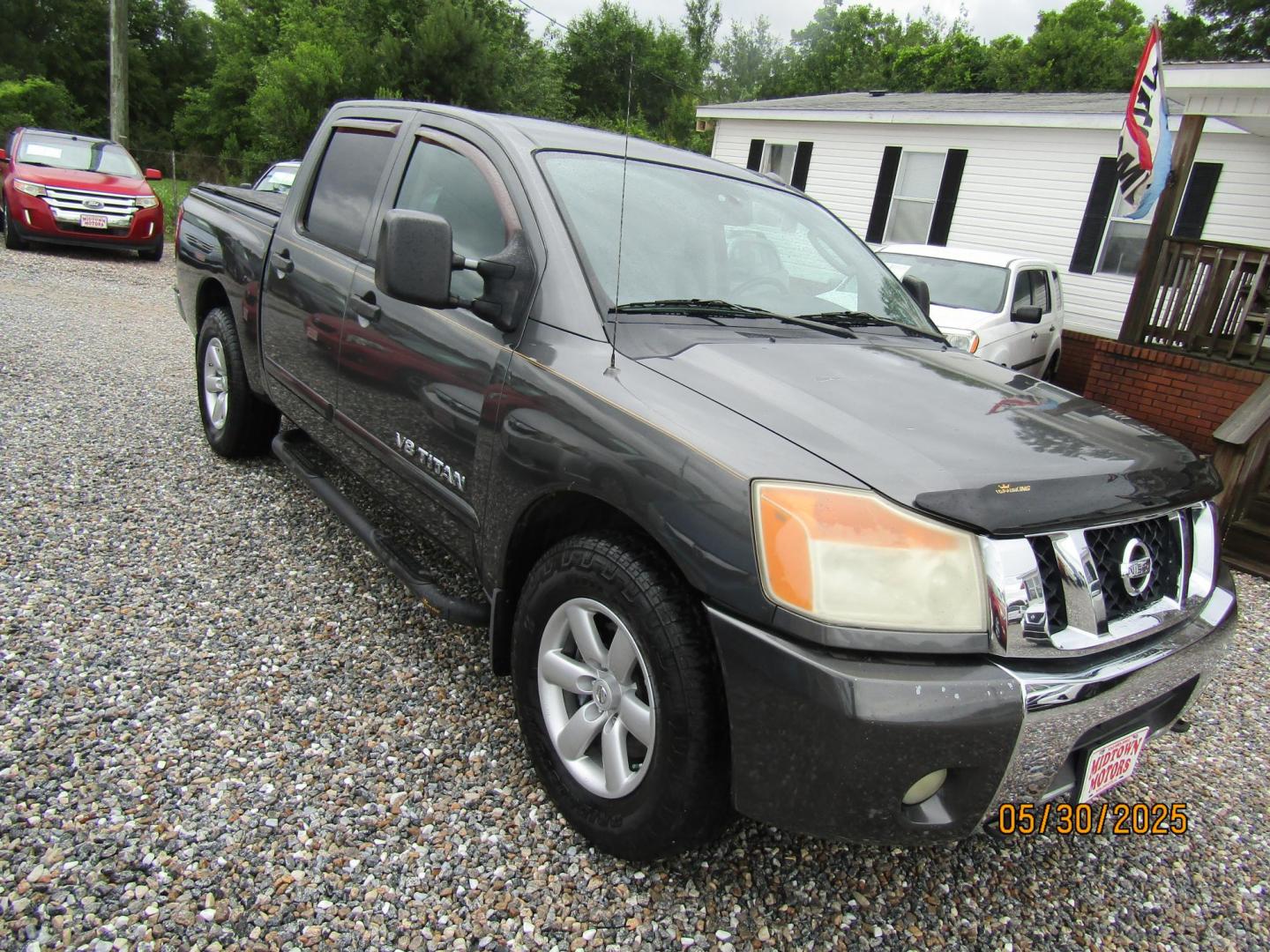 2010 Gray Nissan Titan LE Crew Cab 2WD SWB (1N6AA0ED4AN) with an 5.6L V8 DOHC 32V engine, Automatic transmission, located at 15016 S Hwy 231, Midland City, AL, 36350, (334) 983-3001, 31.306210, -85.495277 - Photo#0