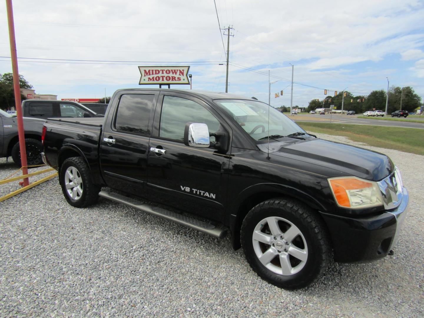 2011 Black /Tan Nissan Titan (1N6BA0ED1BN) with an 8 Cyc engine, Automatic transmission, located at 15016 S Hwy 231, Midland City, AL, 36350, (334) 983-3001, 31.306210, -85.495277 - Photo#0