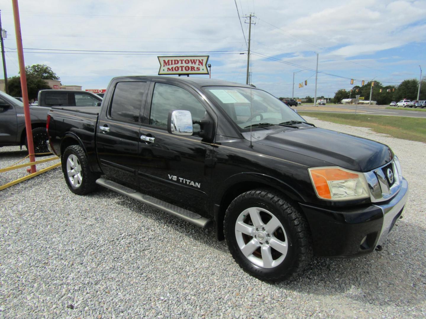 2011 Black /Tan Nissan Titan (1N6BA0ED1BN) with an 8 Cyc engine, Automatic transmission, located at 15016 S Hwy 231, Midland City, AL, 36350, (334) 983-3001, 31.306210, -85.495277 - Photo#1