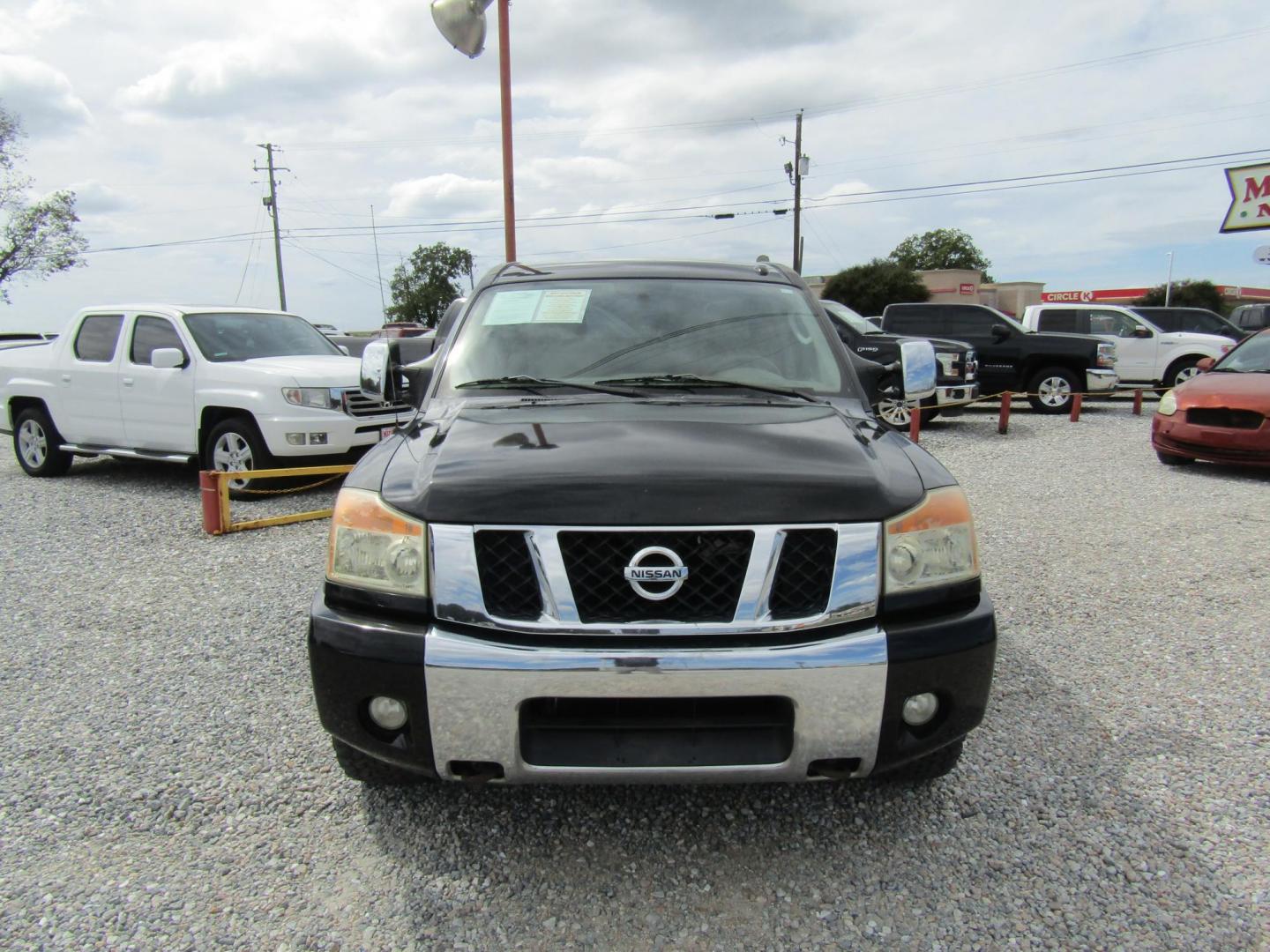 2011 Black /Tan Nissan Titan (1N6BA0ED1BN) with an 8 Cyc engine, Automatic transmission, located at 15016 S Hwy 231, Midland City, AL, 36350, (334) 983-3001, 31.306210, -85.495277 - Photo#2