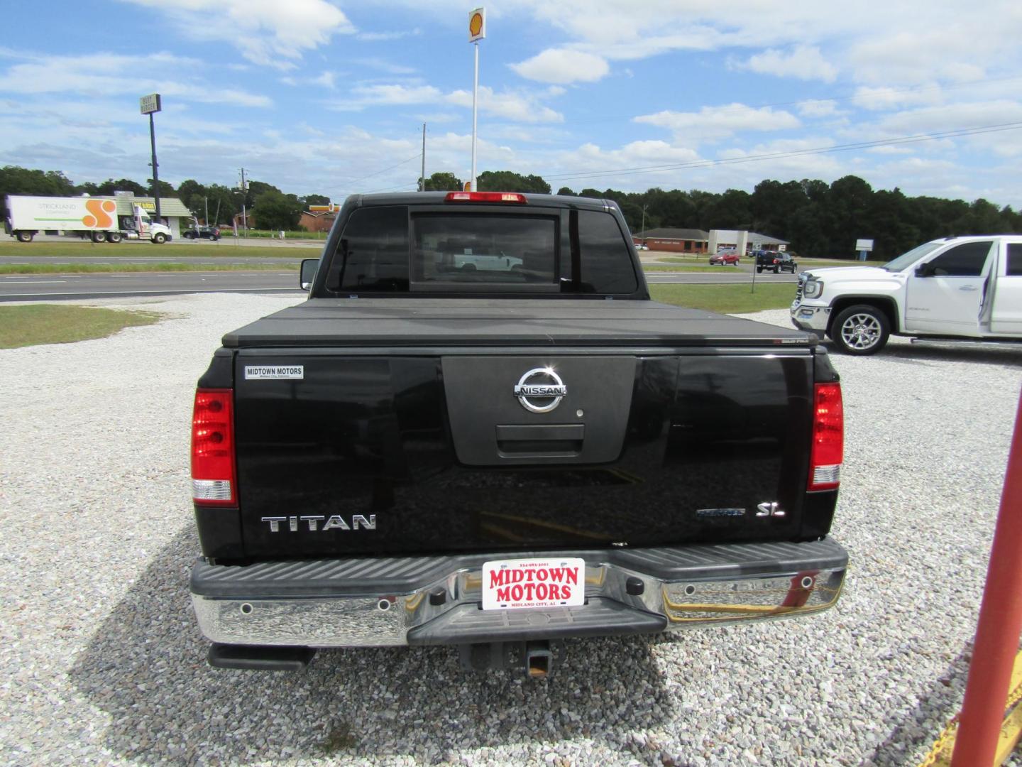 2011 Black /Tan Nissan Titan (1N6BA0ED1BN) with an 8 Cyc engine, Automatic transmission, located at 15016 S Hwy 231, Midland City, AL, 36350, (334) 983-3001, 31.306210, -85.495277 - Photo#7