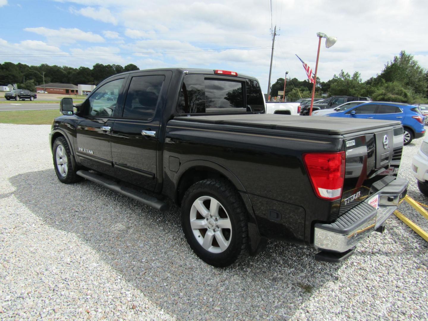 2011 Black /Tan Nissan Titan (1N6BA0ED1BN) with an 8 Cyc engine, Automatic transmission, located at 15016 S Hwy 231, Midland City, AL, 36350, (334) 983-3001, 31.306210, -85.495277 - Photo#6