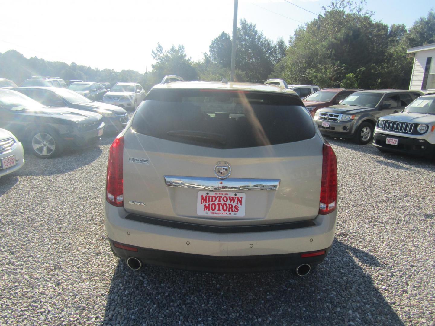 2012 Gold Cadillac SRX Premium (3GYFNCE36CS) with an 3.6L V6 DOHC 24V FFV engine, Automatic transmission, located at 15016 S Hwy 231, Midland City, AL, 36350, (334) 983-3001, 31.306210, -85.495277 - Photo#4