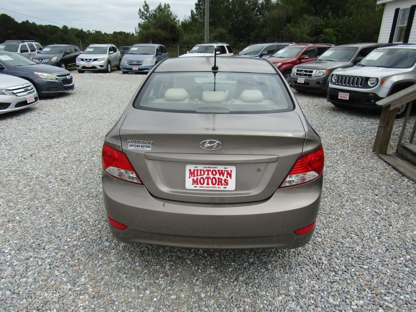 2012 Brown /Tan Hyundai Accent GLS 4-Door (KMHCU4AE1CU) with an 1.6L L4 DOHC 16V engine, Automatic transmission, located at 15016 S Hwy 231, Midland City, AL, 36350, (334) 983-3001, 31.306210, -85.495277 - Photo#4