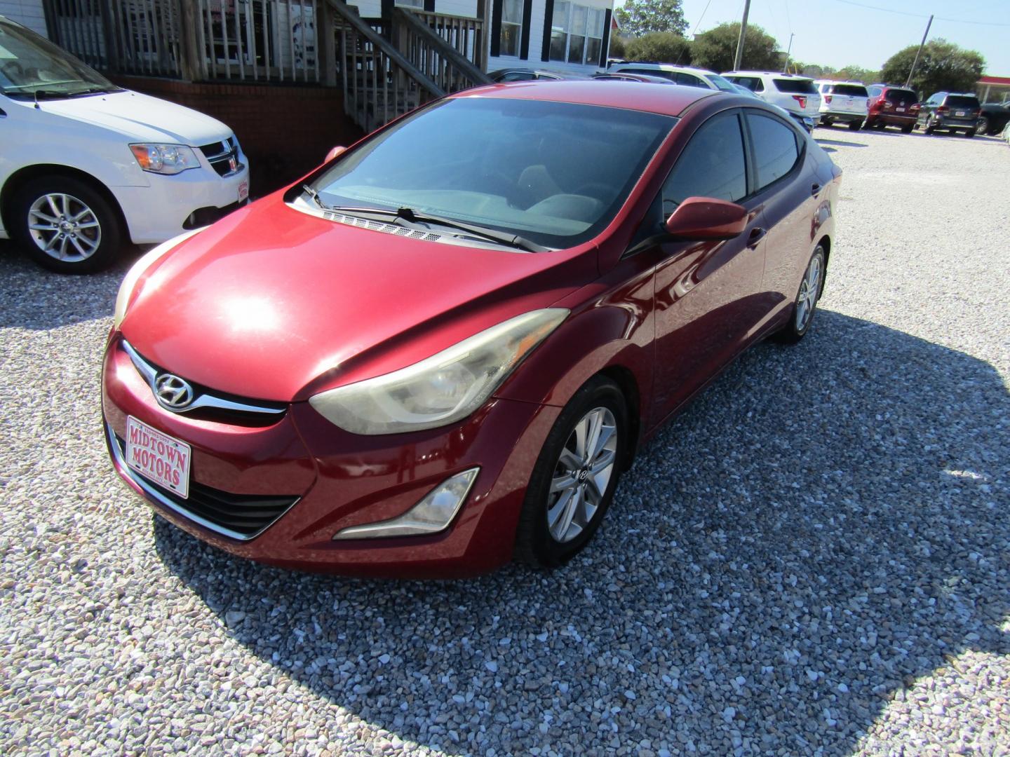 2016 Red /Gray Hyundai Elantra Limited (5NPDH4AE2GH) with an 1.8L L4 DOHC 16V engine, Automatic transmission, located at 15016 S Hwy 231, Midland City, AL, 36350, (334) 983-3001, 31.306210, -85.495277- Photo#2