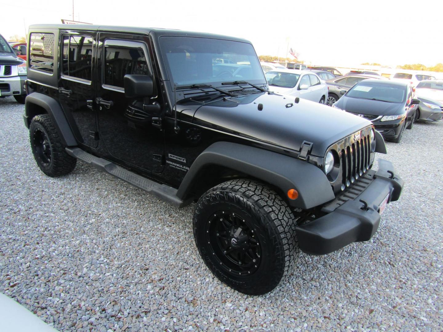 2016 Black Jeep Wrangler Unlimited Sport 4WD (1C4BJWDG9GL) with an 3.6L V6 DOHC 24V FFV engine, Automatic transmission, located at 15016 S Hwy 231, Midland City, AL, 36350, (334) 983-3001, 31.306210, -85.495277 - Photo#0