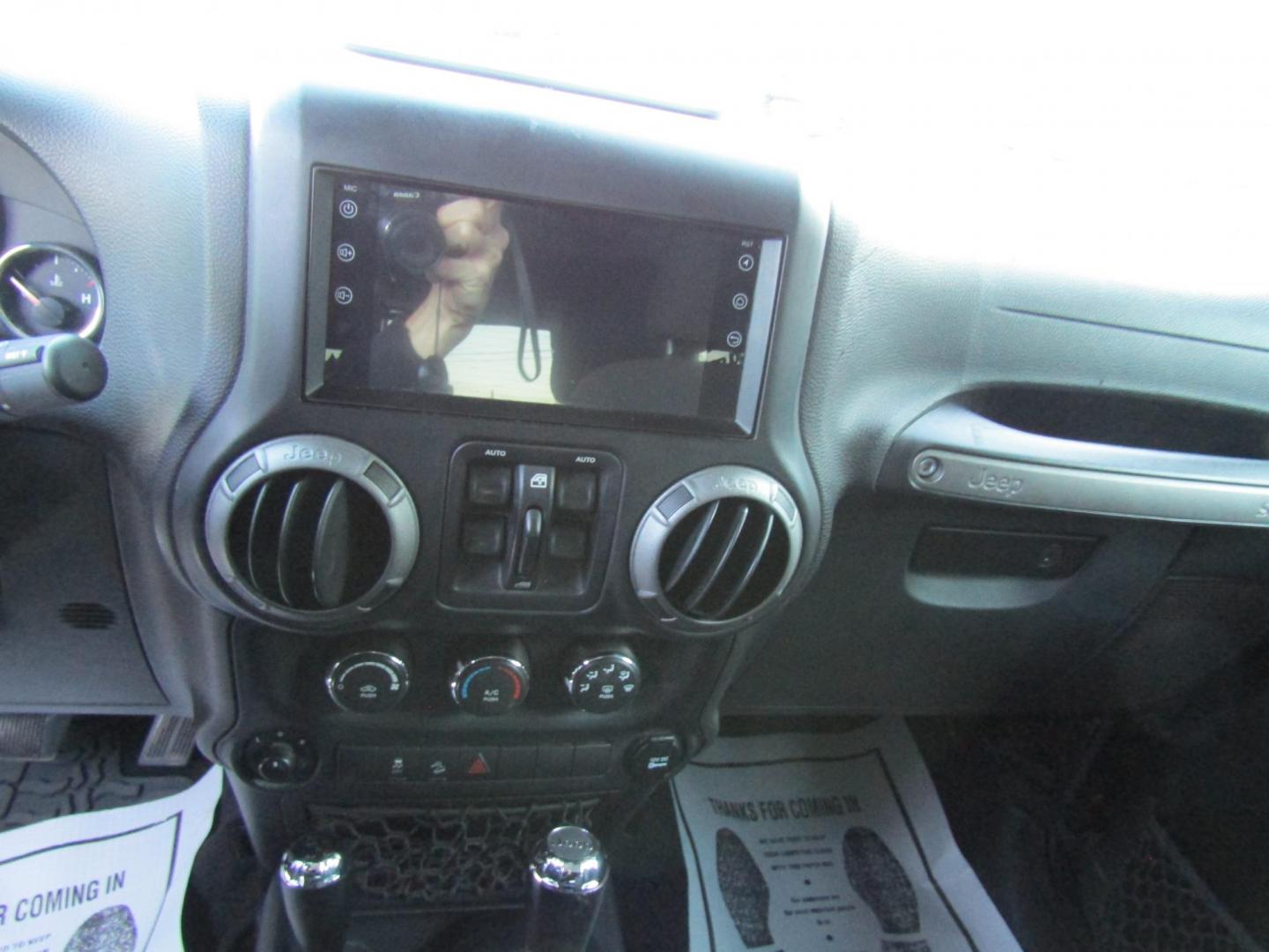 2016 Black Jeep Wrangler Unlimited Sport 4WD (1C4BJWDG9GL) with an 3.6L V6 DOHC 24V FFV engine, Automatic transmission, located at 15016 S Hwy 231, Midland City, AL, 36350, (334) 983-3001, 31.306210, -85.495277 - Photo#4