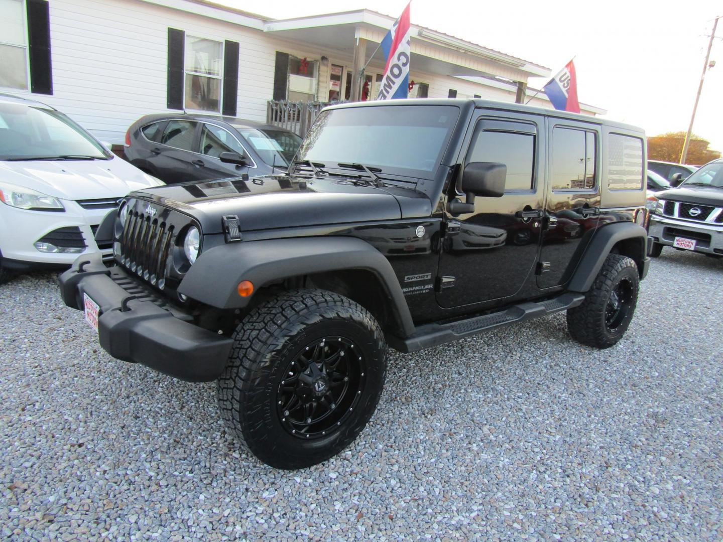 2016 Black Jeep Wrangler Unlimited Sport 4WD (1C4BJWDG9GL) with an 3.6L V6 DOHC 24V FFV engine, Automatic transmission, located at 15016 S Hwy 231, Midland City, AL, 36350, (334) 983-3001, 31.306210, -85.495277 - Photo#2