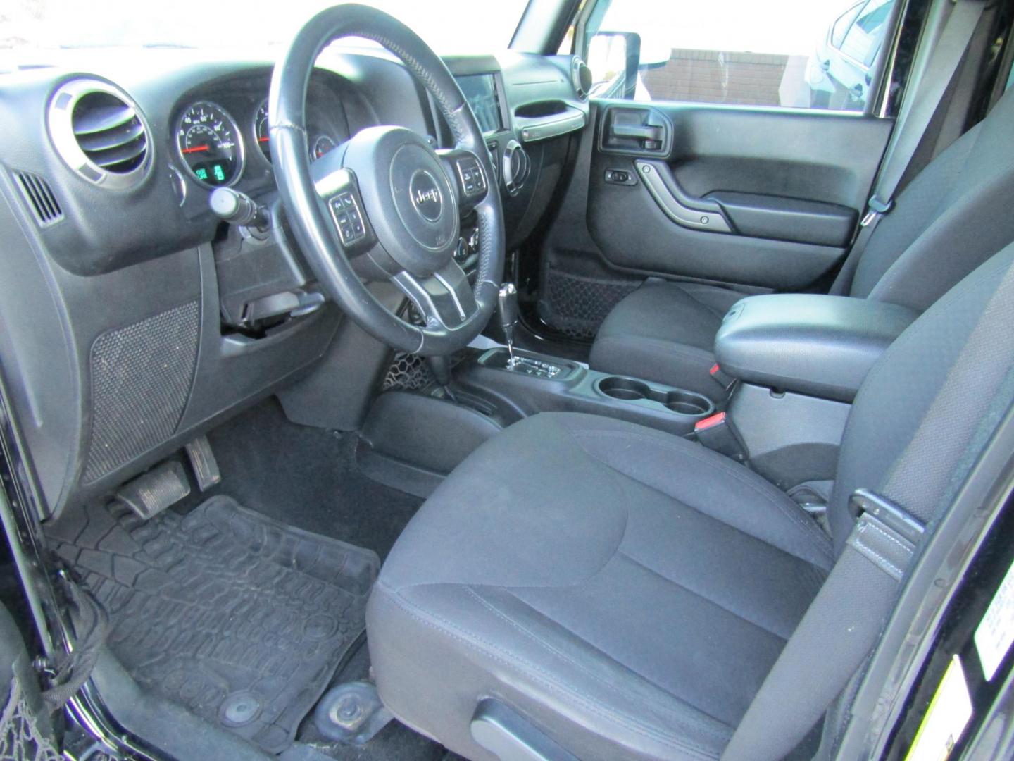 2016 Black Jeep Wrangler Unlimited Sport 4WD (1C4BJWDG9GL) with an 3.6L V6 DOHC 24V FFV engine, Automatic transmission, located at 15016 S Hwy 231, Midland City, AL, 36350, (334) 983-3001, 31.306210, -85.495277 - Photo#3