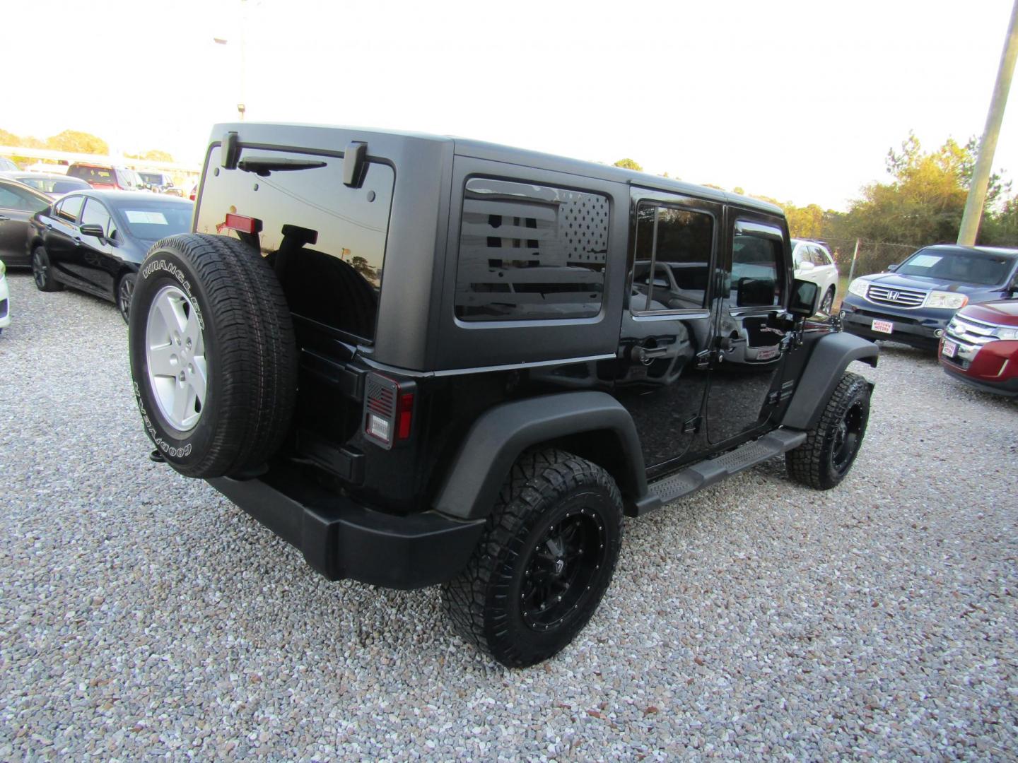 2016 Black Jeep Wrangler Unlimited Sport 4WD (1C4BJWDG9GL) with an 3.6L V6 DOHC 24V FFV engine, Automatic transmission, located at 15016 S Hwy 231, Midland City, AL, 36350, (334) 983-3001, 31.306210, -85.495277 - Photo#6