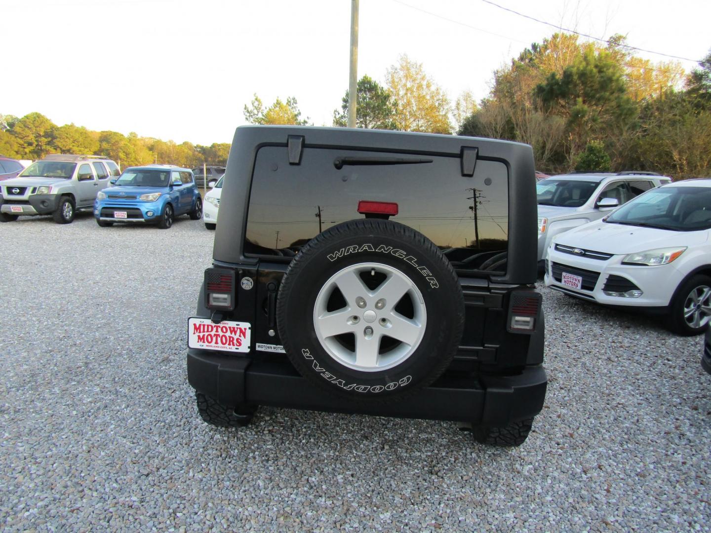 2016 Black Jeep Wrangler Unlimited Sport 4WD (1C4BJWDG9GL) with an 3.6L V6 DOHC 24V FFV engine, Automatic transmission, located at 15016 S Hwy 231, Midland City, AL, 36350, (334) 983-3001, 31.306210, -85.495277 - Photo#7