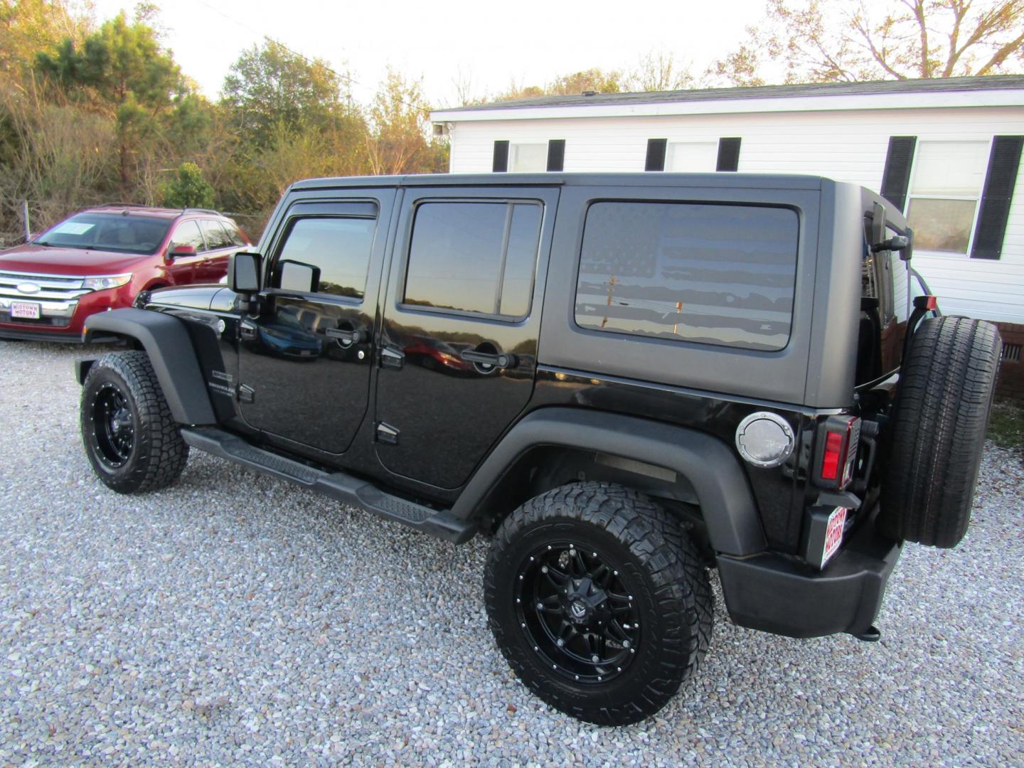 2016 Black Jeep Wrangler Unlimited Sport 4WD (1C4BJWDG9GL) with an 3.6L V6 DOHC 24V FFV engine, Automatic transmission, located at 15016 S Hwy 231, Midland City, AL, 36350, (334) 983-3001, 31.306210, -85.495277 - Photo#8