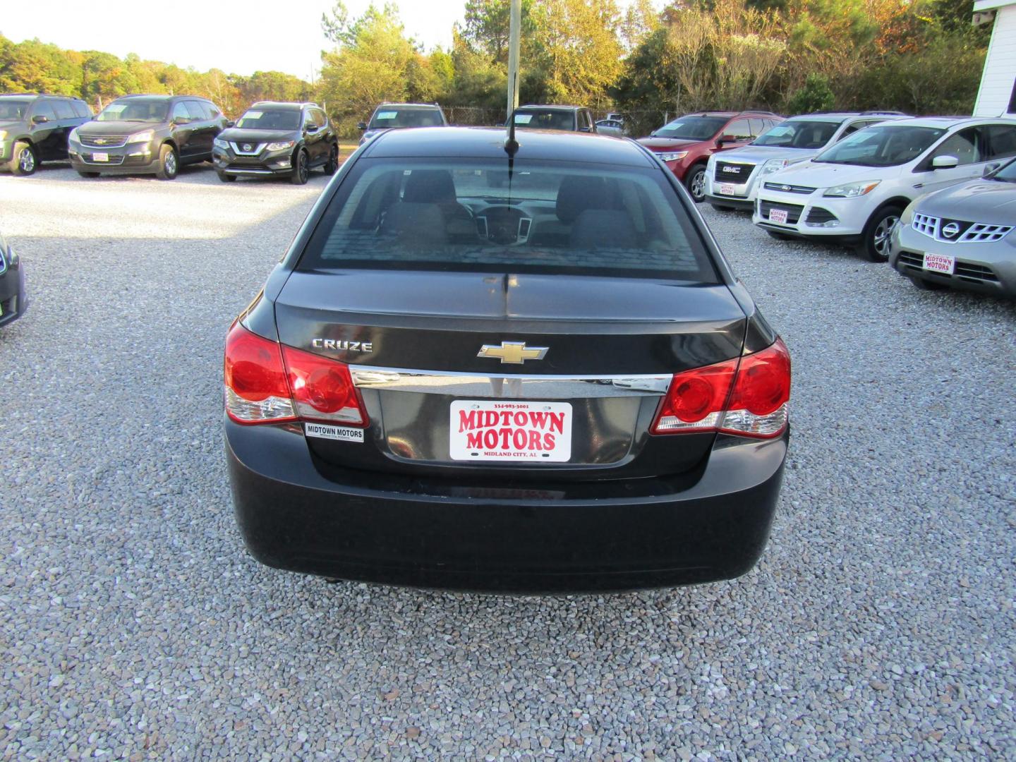 2013 Black Chevrolet Cruze LS Auto (1G1PA5SHXD7) with an 1.8L L4 DOHC 16V FFV engine, Automatic transmission, located at 15016 S Hwy 231, Midland City, AL, 36350, (334) 983-3001, 31.306210, -85.495277 - Photo#5