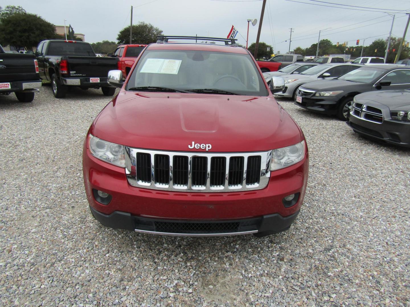 2011 Red Jeep Grand Cherokee Limited 2WD (1J4RS5GG5BC) with an 3.6L V6 DOHC 24V engine, Automatic transmission, located at 15016 S Hwy 231, Midland City, AL, 36350, (334) 983-3001, 31.306210, -85.495277 - Photo#1