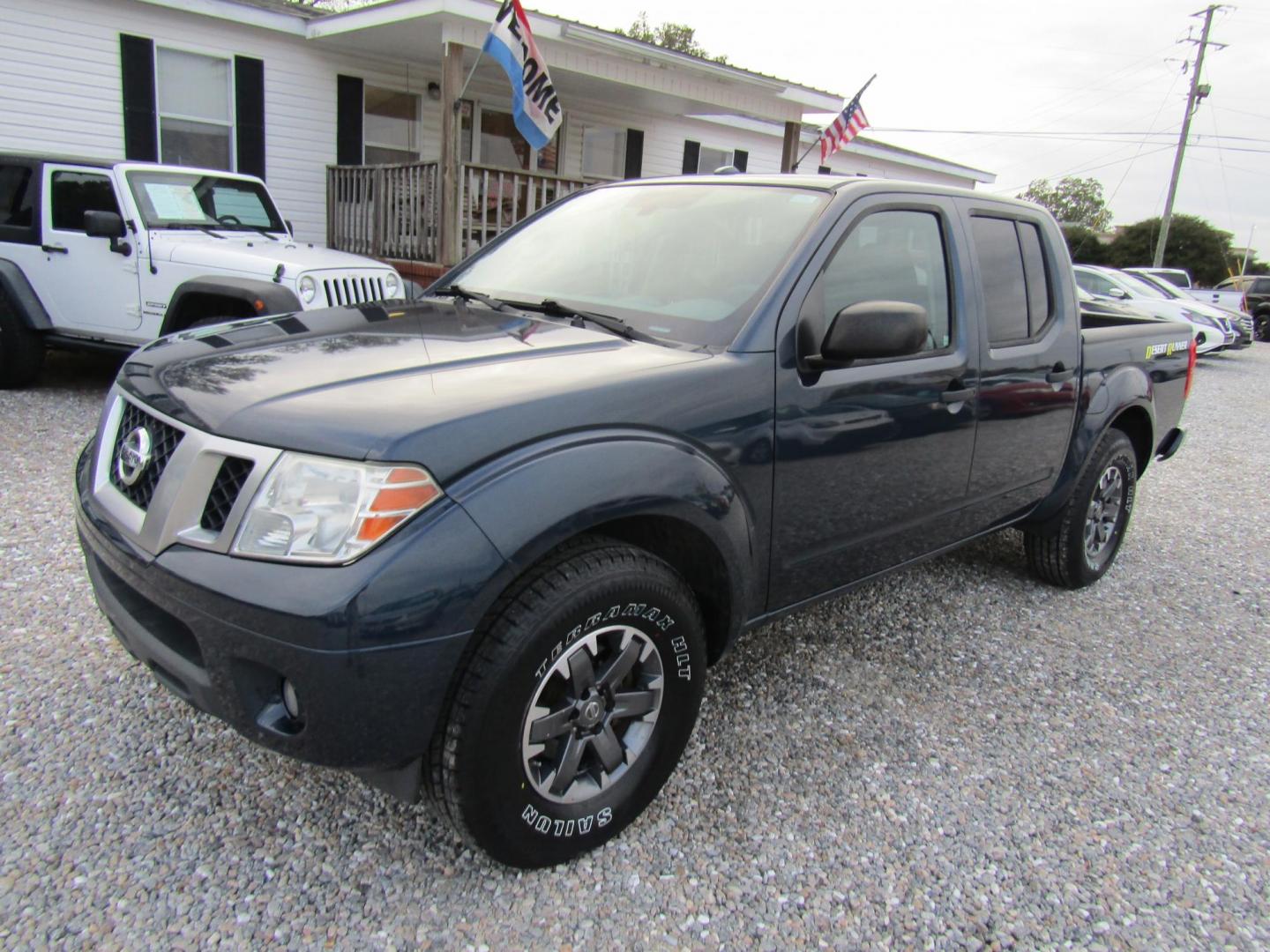 2015 Blue Nissan Frontier S Crew Cab 5AT 2WD (1N6AD0ER4FN) with an 4.0L V6 DOHC 24V engine, Automatic transmission, located at 15016 S Hwy 231, Midland City, AL, 36350, (334) 983-3001, 31.306210, -85.495277 - Photo#1