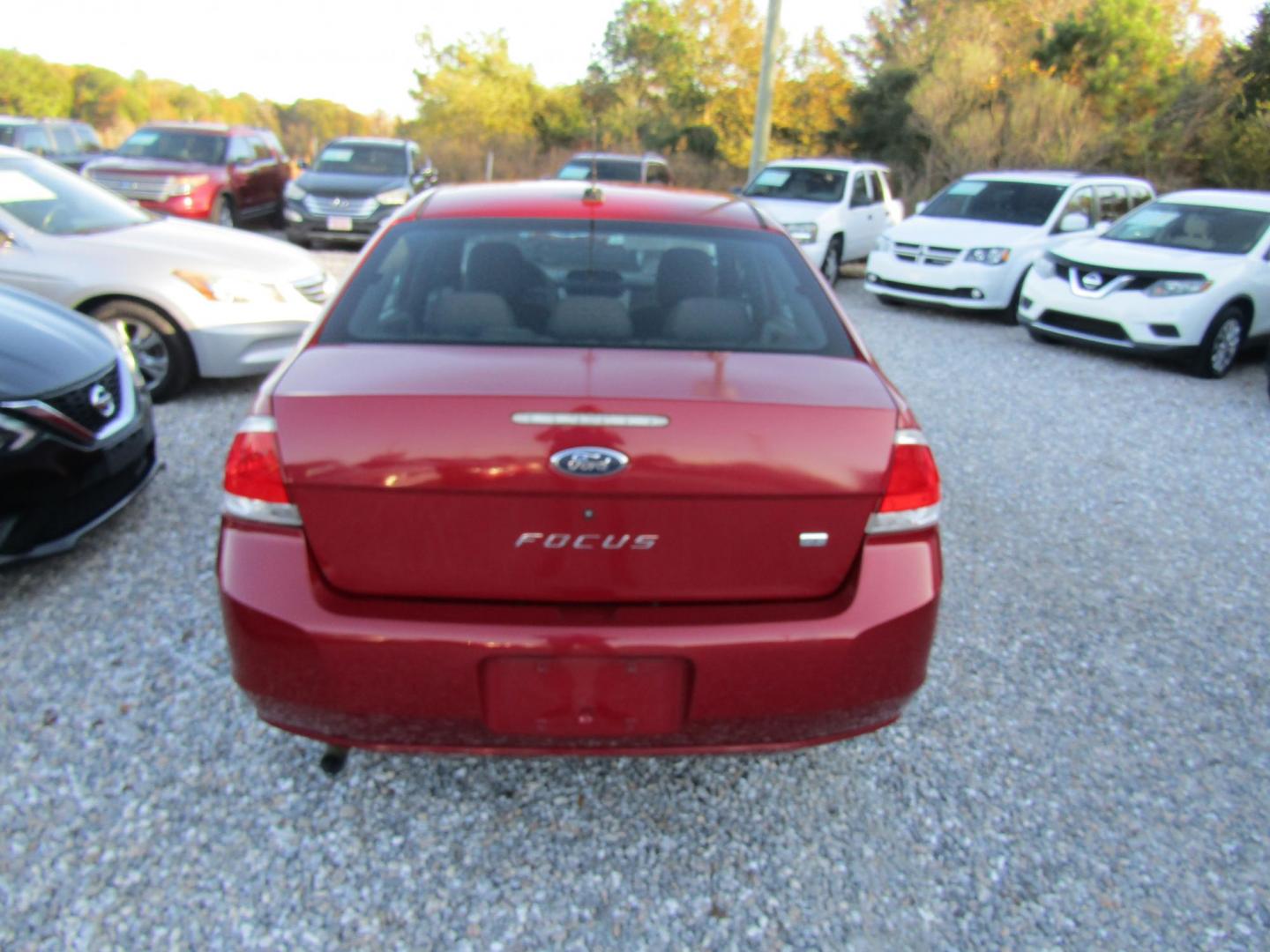 2009 Red Ford Focus SE Sedan (1FAHP35N99W) with an 2.0L L4 DOHC 16V engine, Automatic transmission, located at 15016 S Hwy 231, Midland City, AL, 36350, (334) 983-3001, 31.306210, -85.495277 - Photo#6
