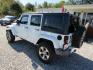 2016 White Jeep Wrangler Unlimited Sahara 4WD (1C4BJWEG9GL) with an 3.6L V6 DOHC 24V FFV engine, Automatic transmission, located at 15016 S Hwy 231, Midland City, AL, 36350, (334) 983-3001, 31.306210, -85.495277 - Photo#3