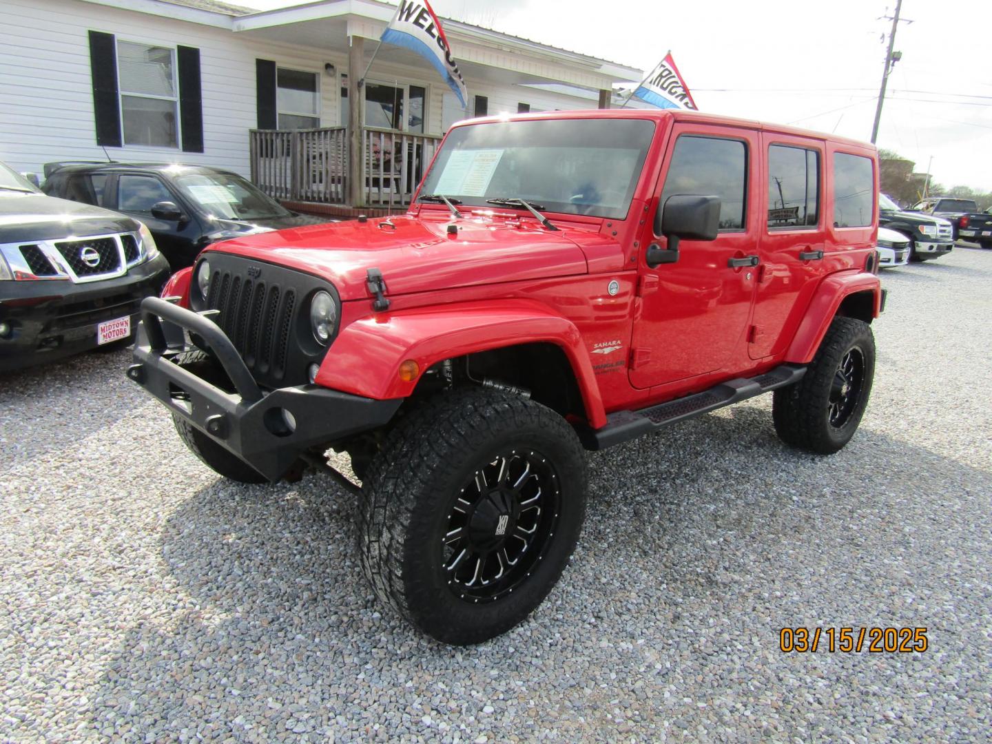 2015 Red Jeep Wrangler Unlimited Sahara 4WD (1C4BJWEG4FL) with an 3.6L V6 DOHC 24V FFV engine, Automatic transmission, located at 15016 S Hwy 231, Midland City, AL, 36350, (334) 983-3001, 31.306210, -85.495277 - Photo#2