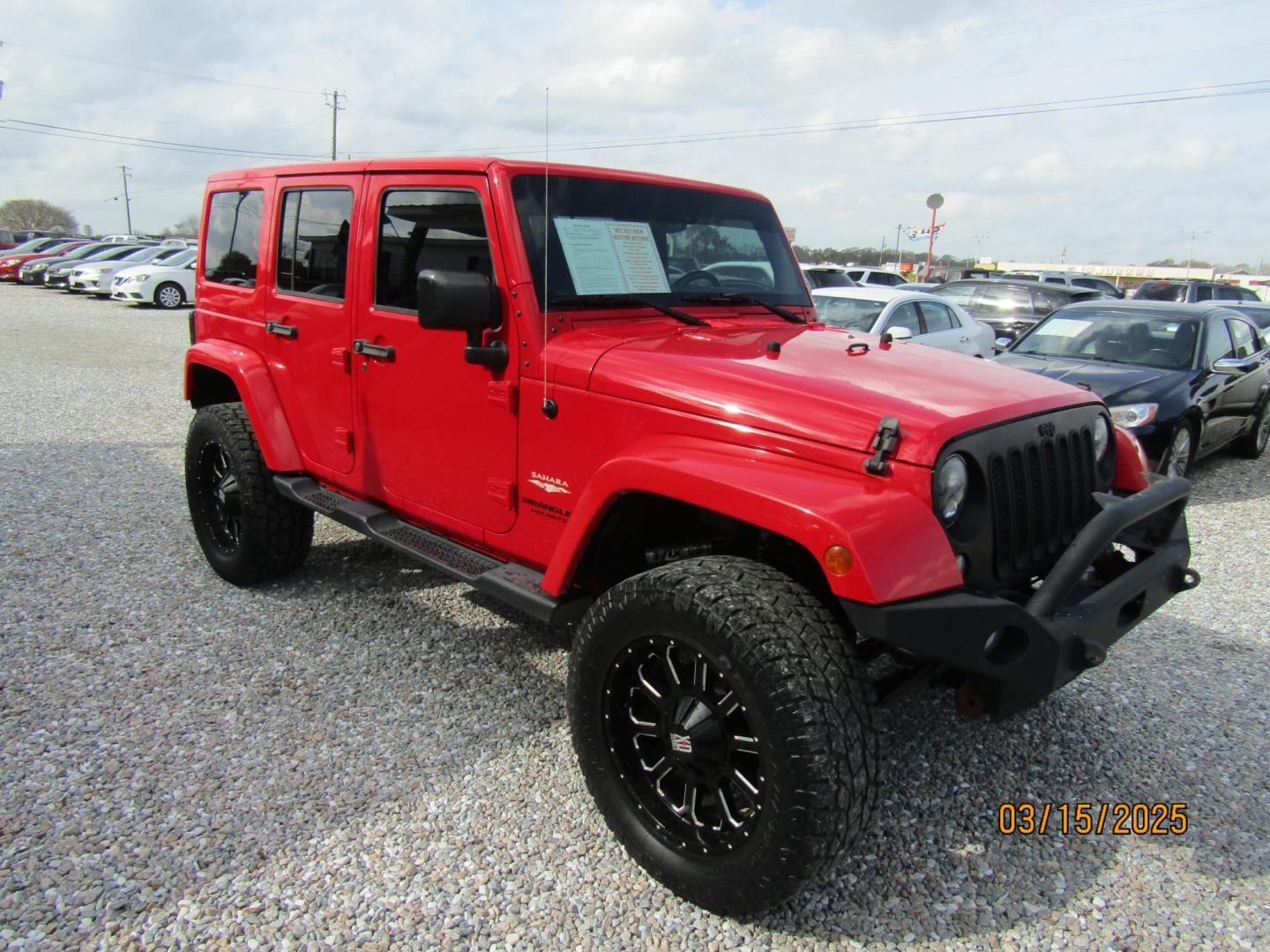 2015 Red Jeep Wrangler Unlimited Sahara 4WD (1C4BJWEG4FL) with an 3.6L V6 DOHC 24V FFV engine, Automatic transmission, located at 15016 S Hwy 231, Midland City, AL, 36350, (334) 983-3001, 31.306210, -85.495277 - Photo#0