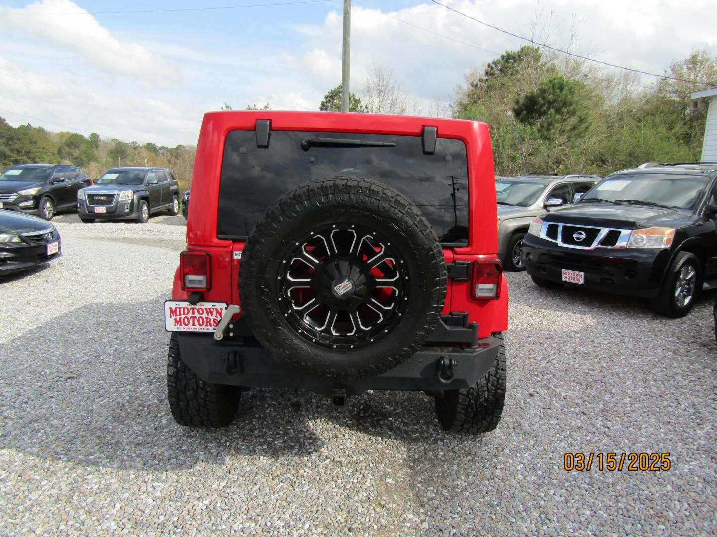 2015 Red Jeep Wrangler Unlimited Sahara 4WD (1C4BJWEG4FL) with an 3.6L V6 DOHC 24V FFV engine, Automatic transmission, located at 15016 S Hwy 231, Midland City, AL, 36350, (334) 983-3001, 31.306210, -85.495277 - Photo#6