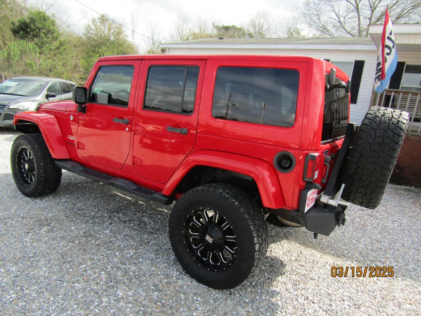 2015 Red Jeep Wrangler Unlimited Sahara 4WD (1C4BJWEG4FL) with an 3.6L V6 DOHC 24V FFV engine, Automatic transmission, located at 15016 S Hwy 231, Midland City, AL, 36350, (334) 983-3001, 31.306210, -85.495277 - Photo#5