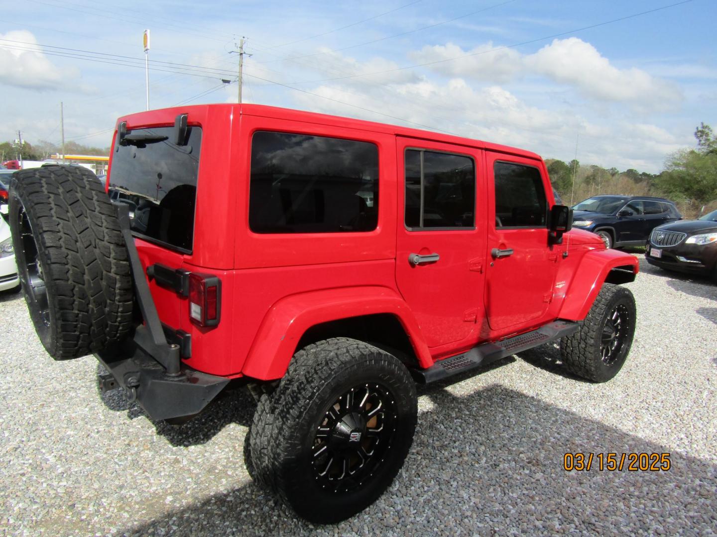 2015 Red Jeep Wrangler Unlimited Sahara 4WD (1C4BJWEG4FL) with an 3.6L V6 DOHC 24V FFV engine, Automatic transmission, located at 15016 S Hwy 231, Midland City, AL, 36350, (334) 983-3001, 31.306210, -85.495277 - Photo#7