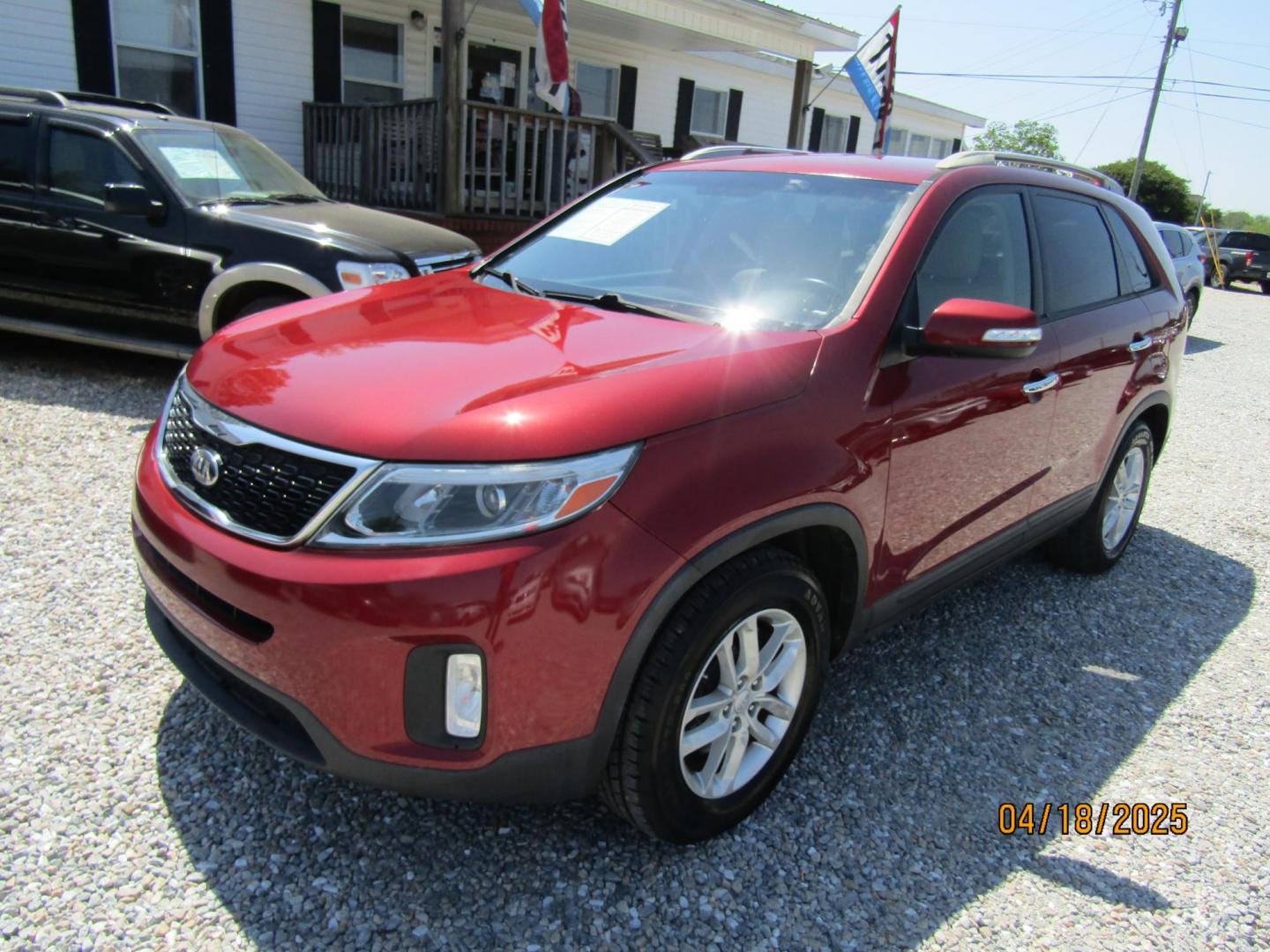 2015 Red Kia Sorento LX V6 FWD (5XYKT4A77FG) with an 3.3L V6 DOHC 24V engine, Automatic transmission, located at 15016 S Hwy 231, Midland City, AL, 36350, (334) 983-3001, 31.306210, -85.495277 - Photo#1