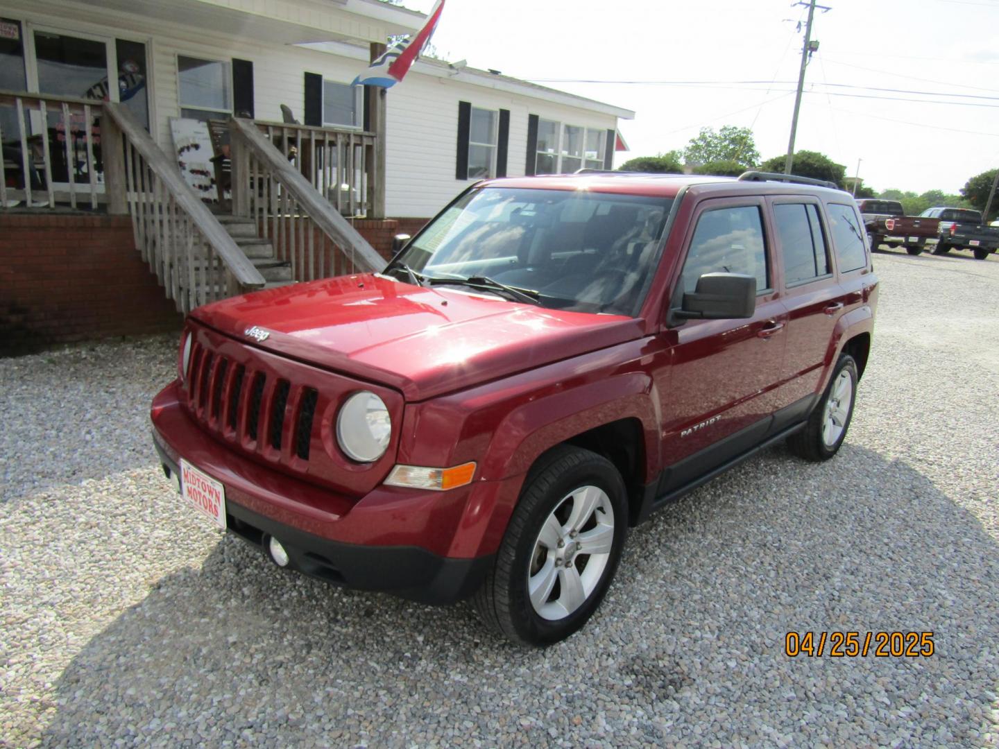 2014 Red Jeep Patriot Latitude 2WD (1C4NJPFB7ED) with an 2.4L L4 DOHC 16V engine, Automatic transmission, located at 15016 S Hwy 231, Midland City, AL, 36350, (334) 983-3001, 31.306210, -85.495277 - Photo#2