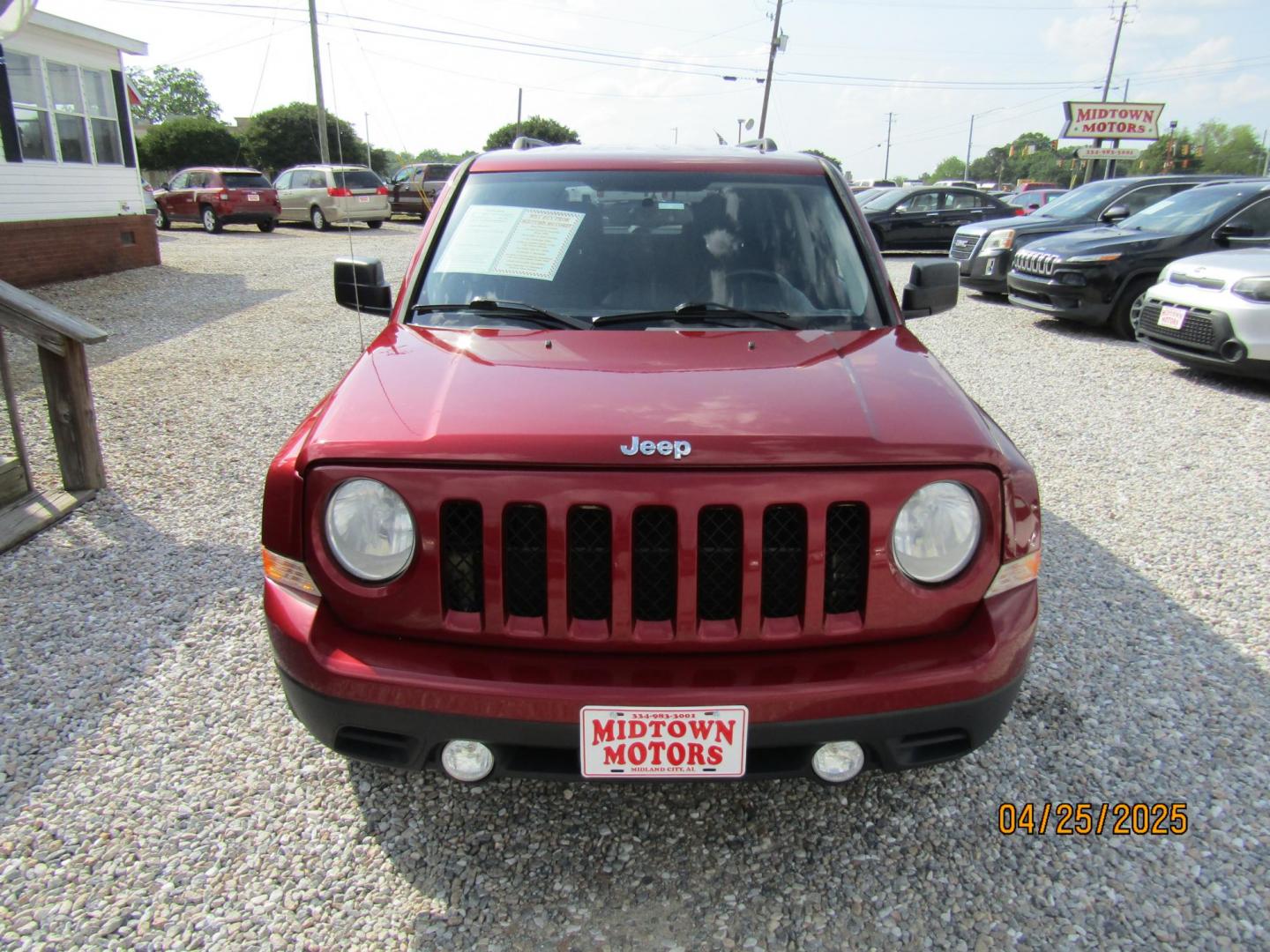 2014 Red Jeep Patriot Latitude 2WD (1C4NJPFB7ED) with an 2.4L L4 DOHC 16V engine, Automatic transmission, located at 15016 S Hwy 231, Midland City, AL, 36350, (334) 983-3001, 31.306210, -85.495277 - Photo#1