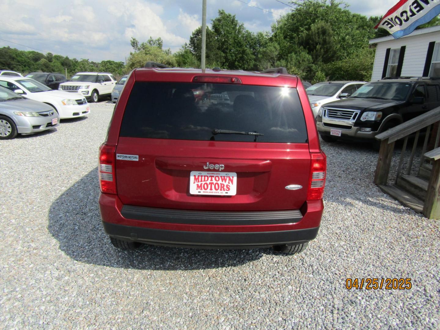 2014 Red Jeep Patriot Latitude 2WD (1C4NJPFB7ED) with an 2.4L L4 DOHC 16V engine, Automatic transmission, located at 15016 S Hwy 231, Midland City, AL, 36350, (334) 983-3001, 31.306210, -85.495277 - Photo#6