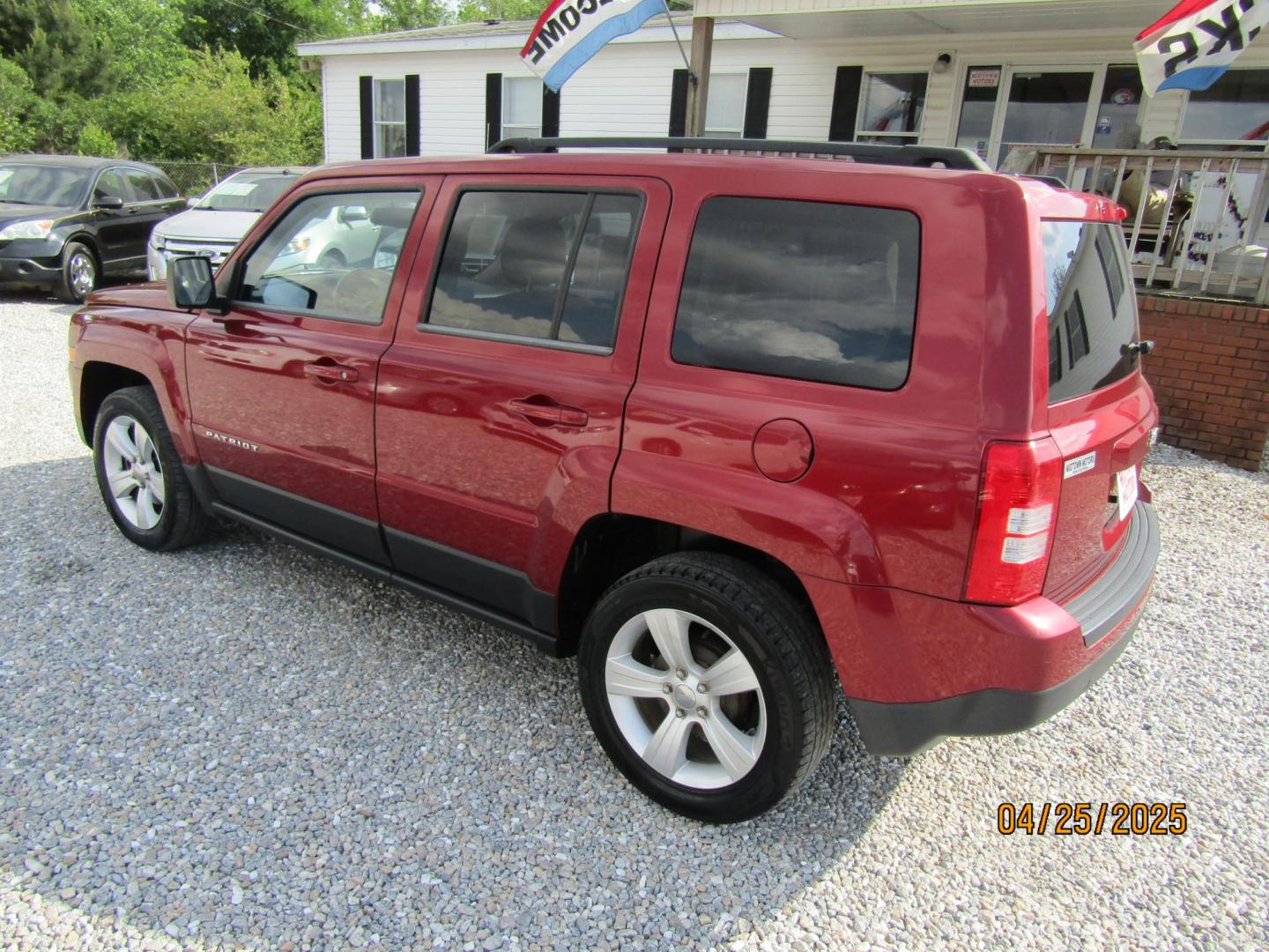 2014 Red Jeep Patriot Latitude 2WD (1C4NJPFB7ED) with an 2.4L L4 DOHC 16V engine, Automatic transmission, located at 15016 S Hwy 231, Midland City, AL, 36350, (334) 983-3001, 31.306210, -85.495277 - Photo#7