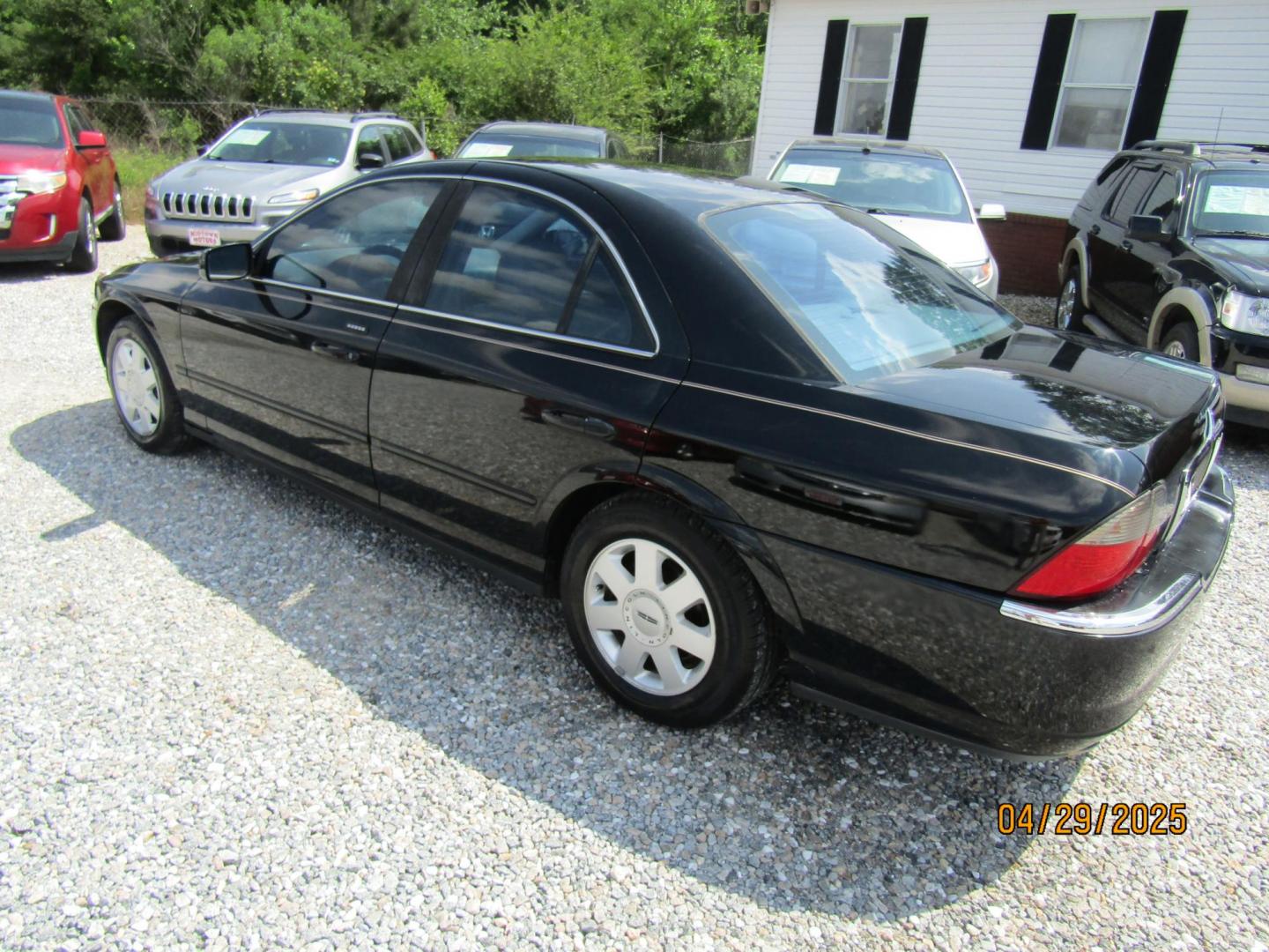 2004 Black Lincoln LS V6 Appearance (1LNHM86SX4Y) with an 3.0L V6 DOHC 24V engine, Automatic transmission, located at 15016 S Hwy 231, Midland City, AL, 36350, (334) 983-3001, 31.306210, -85.495277 - Photo#4