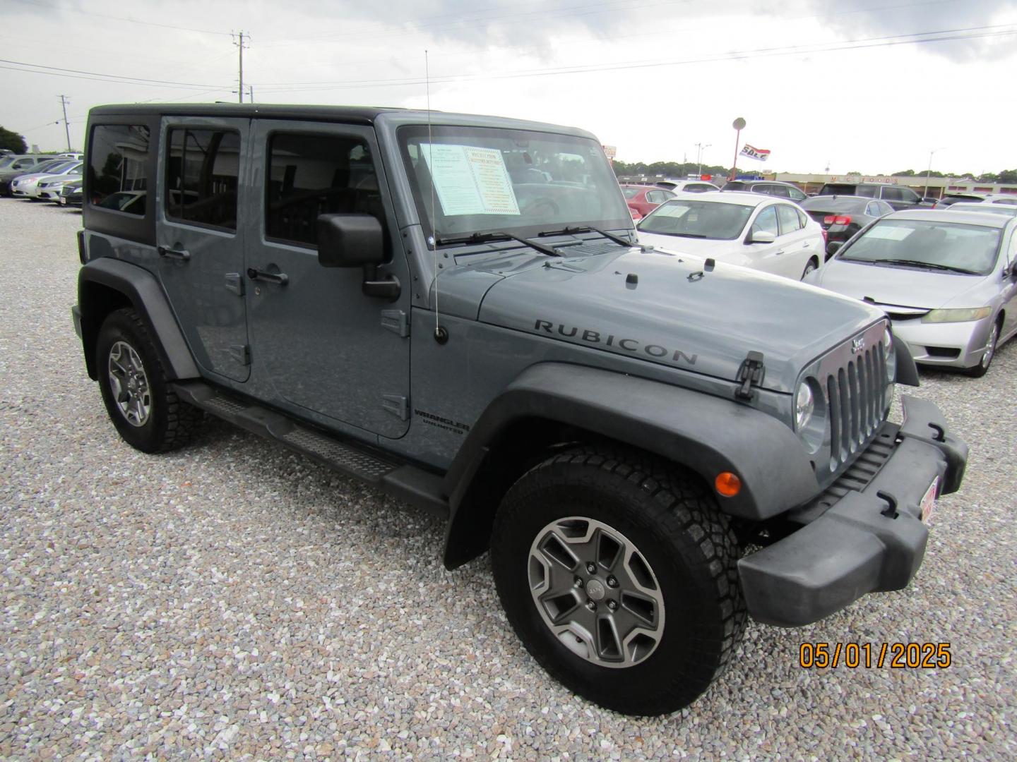 2014 Gray Jeep Wrangler Unlimited Rubicon 4WD (1C4HJWFG1EL) with an 3.6L V6 DOHC 24V FFV engine, Automatic transmission, located at 15016 S Hwy 231, Midland City, AL, 36350, (334) 983-3001, 31.306210, -85.495277 - Photo#0