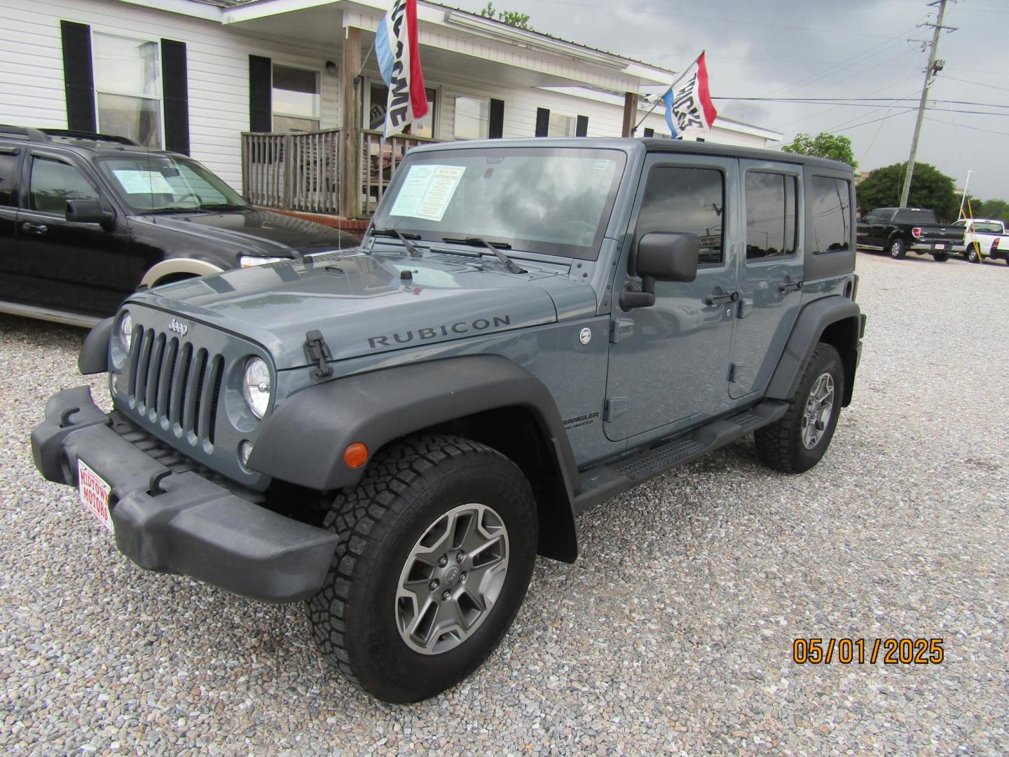 2014 Gray Jeep Wrangler Unlimited Rubicon 4WD (1C4HJWFG1EL) with an 3.6L V6 DOHC 24V FFV engine, Automatic transmission, located at 15016 S Hwy 231, Midland City, AL, 36350, (334) 983-3001, 31.306210, -85.495277 - Photo#2