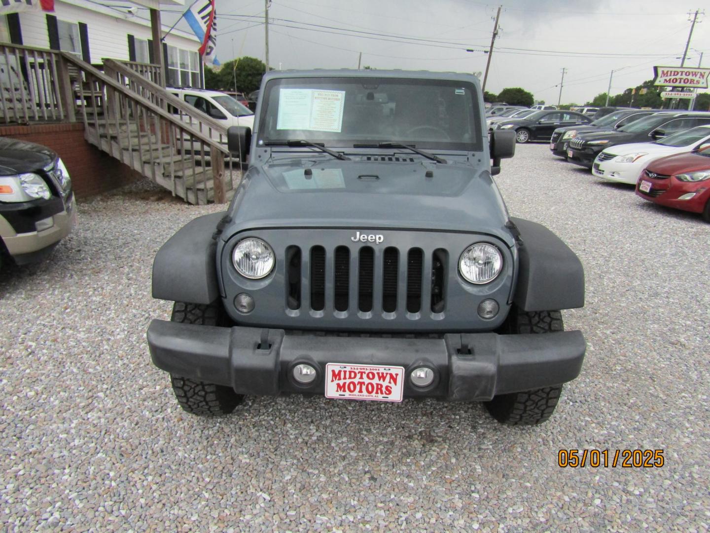 2014 Gray Jeep Wrangler Unlimited Rubicon 4WD (1C4HJWFG1EL) with an 3.6L V6 DOHC 24V FFV engine, Automatic transmission, located at 15016 S Hwy 231, Midland City, AL, 36350, (334) 983-3001, 31.306210, -85.495277 - Photo#1