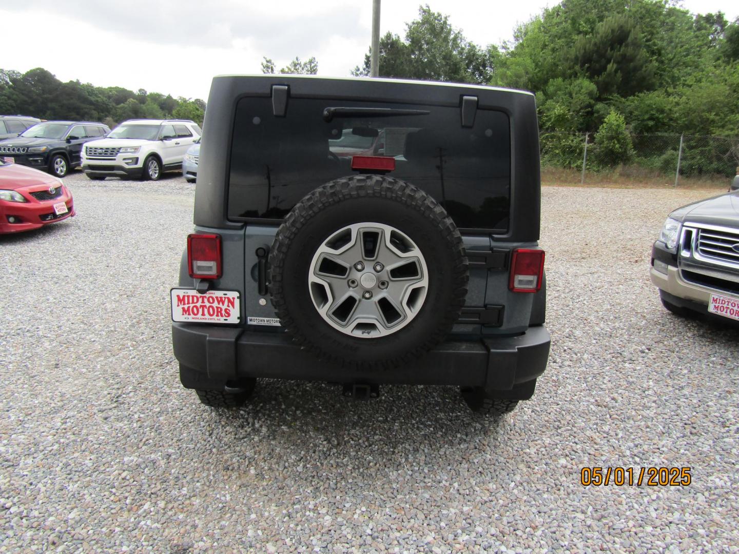 2014 Gray Jeep Wrangler Unlimited Rubicon 4WD (1C4HJWFG1EL) with an 3.6L V6 DOHC 24V FFV engine, Automatic transmission, located at 15016 S Hwy 231, Midland City, AL, 36350, (334) 983-3001, 31.306210, -85.495277 - Photo#6