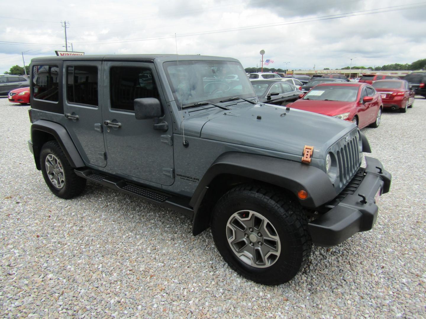 2014 Gray Jeep Wrangler Unlimited Rubicon 4WD (1C4HJWFG1EL) with an 3.6L V6 DOHC 24V FFV engine, Automatic transmission, located at 15016 S Hwy 231, Midland City, AL, 36350, (334) 983-3001, 31.306210, -85.495277- Photo#0
